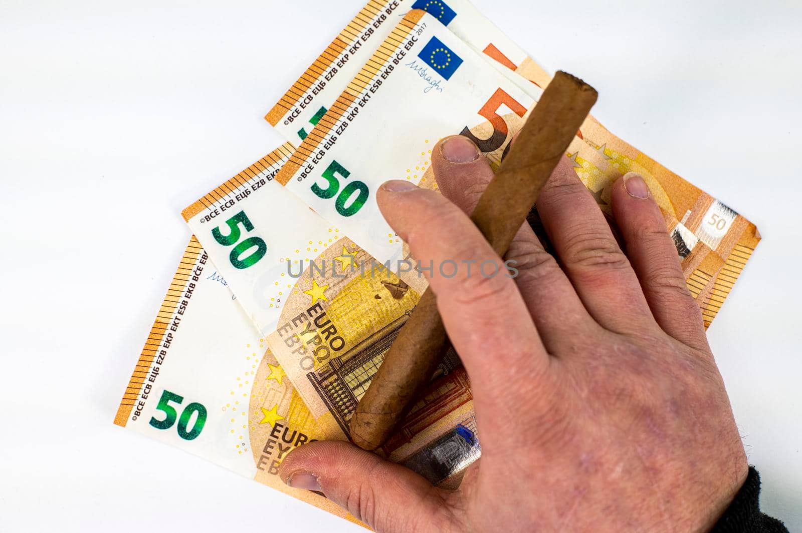 50 euro bills with man hand holding cigar on white background