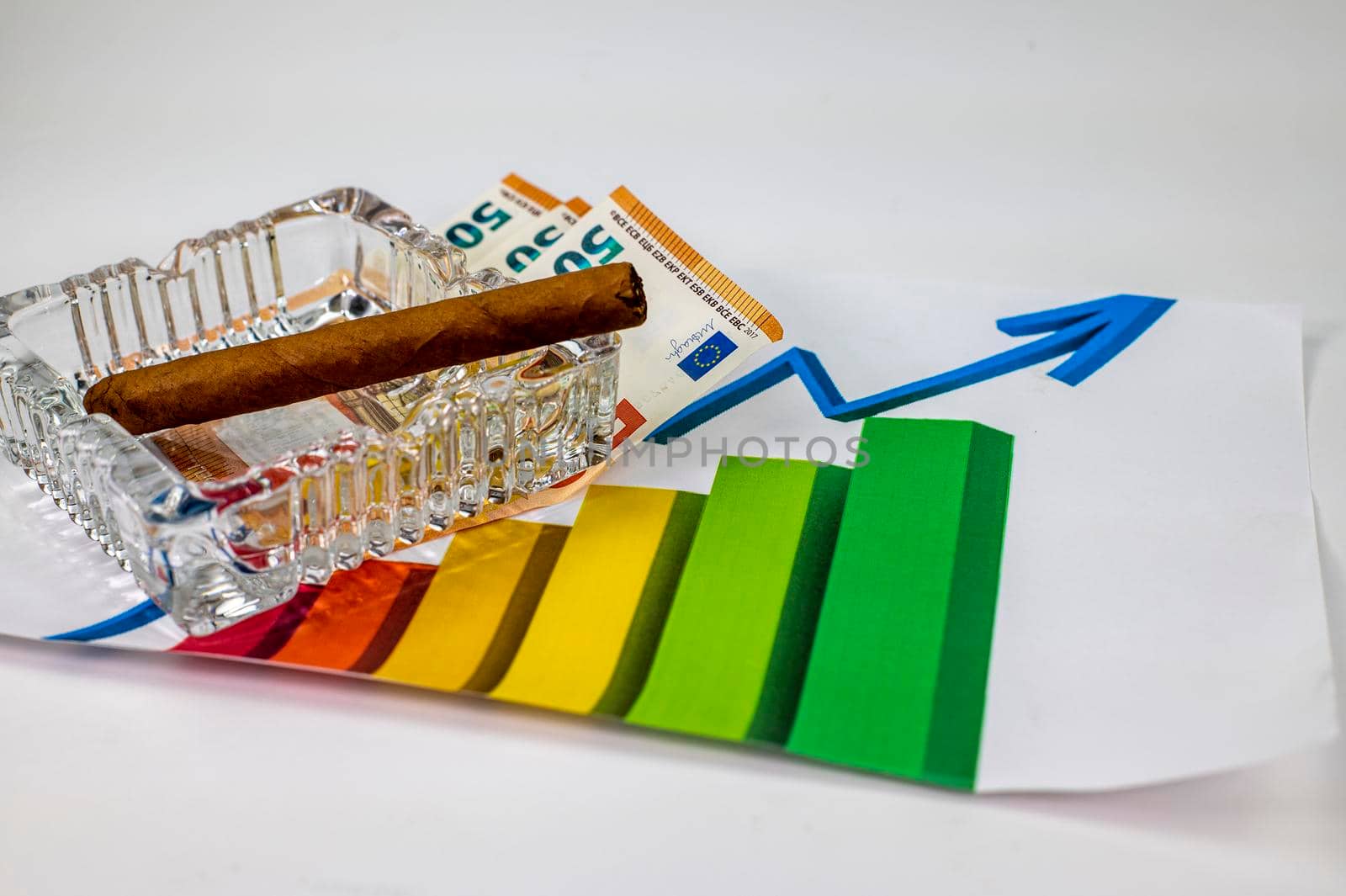 50 euro bills with graph and cigar on white background