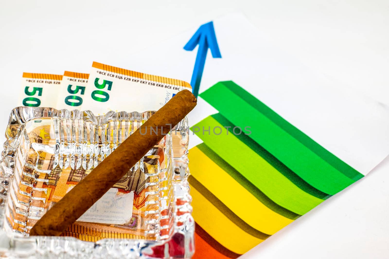 50 euro bills with graph and cigar on white background