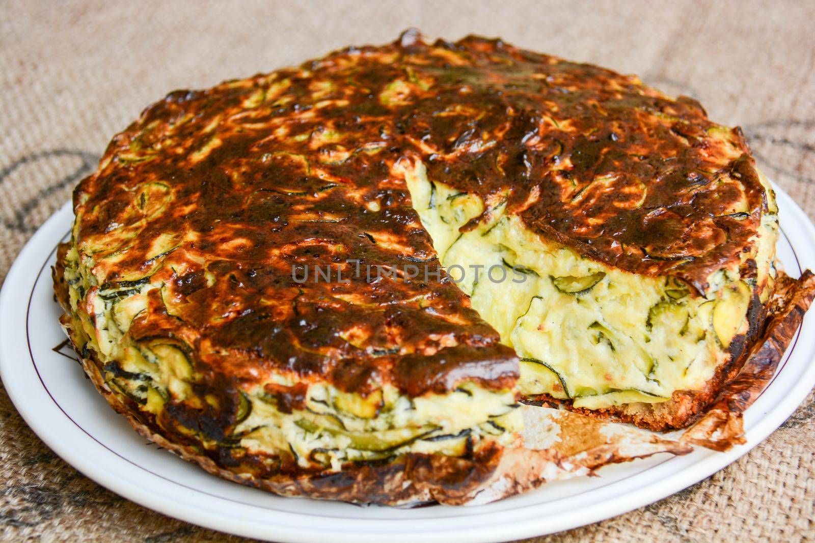 homemade savory cake with zucchini, goat cheese, ricotta, eggs and the wisdom of the grandmother