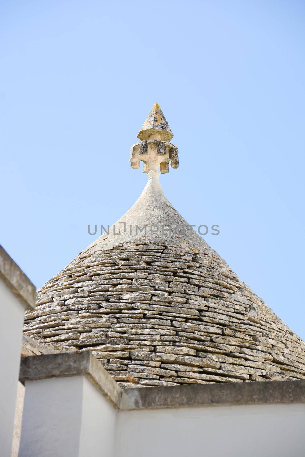 magic superstitious and esoteric symbols placed to finish the roofs of trulli in antiquity to chase away evil spirits