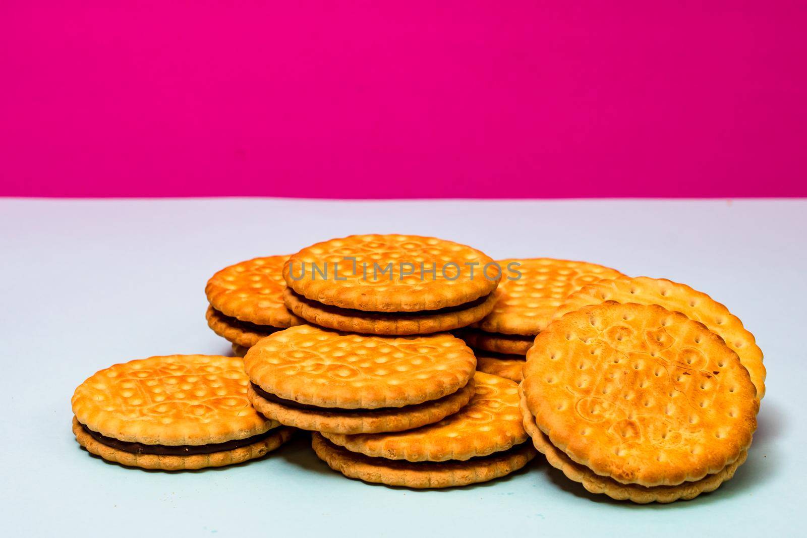 Round biscuits with chocolate cream, sandwich biscuits with chocolate filling isolated. by vladispas