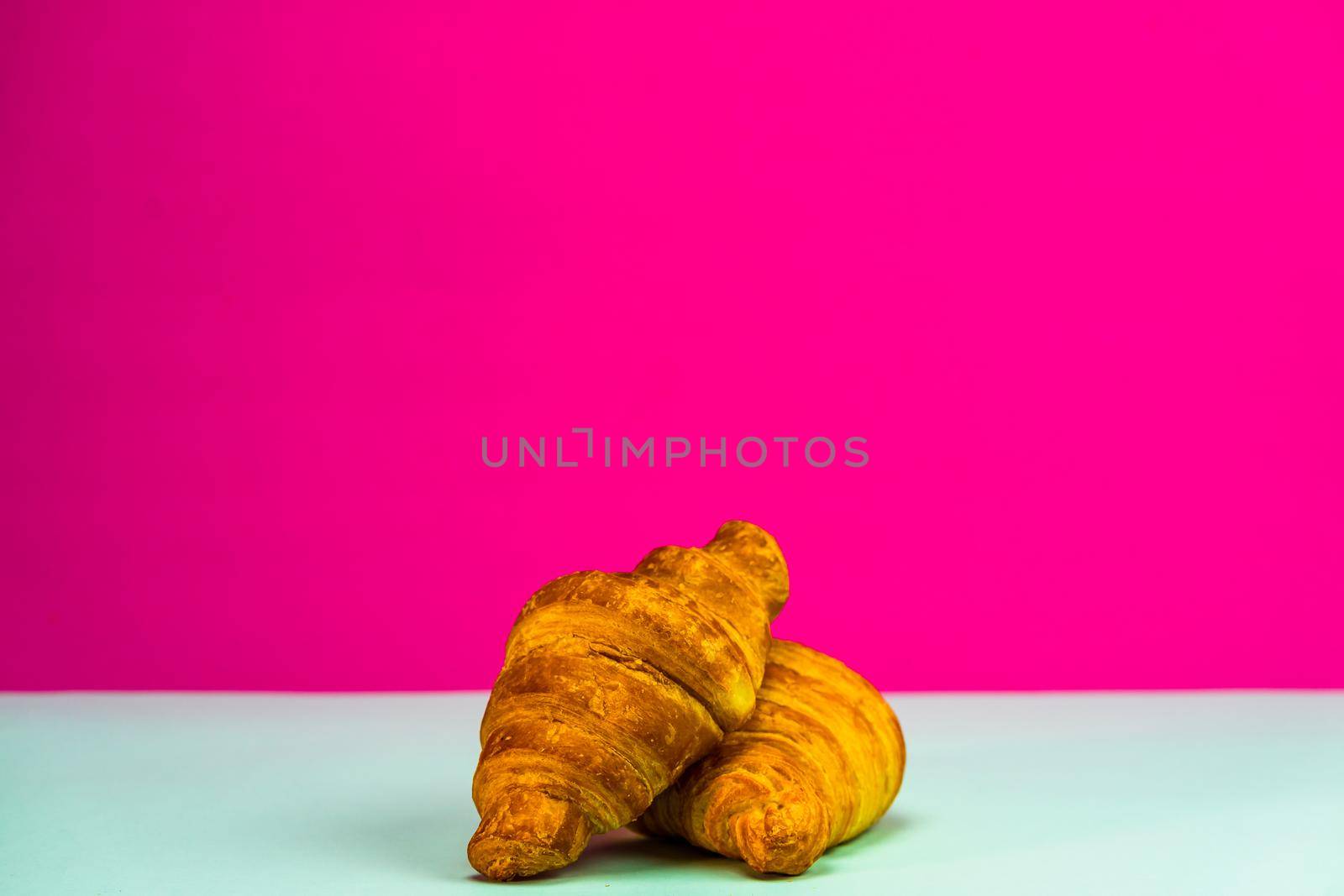 Fresh and delicious croissants isolated. French breakfast concept.