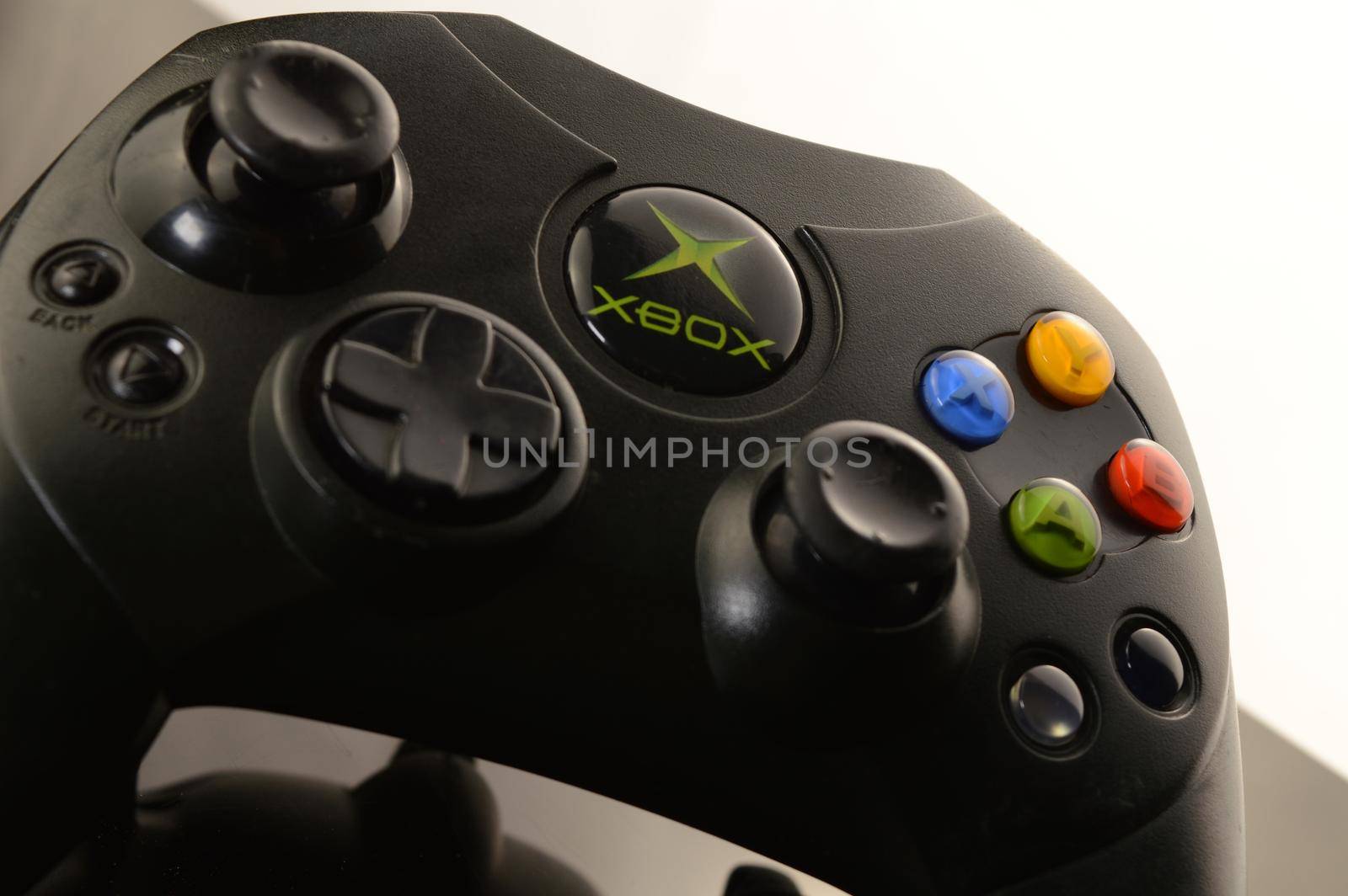 SMITHS FALLS, ONTARIO, CANADA: JANUARY 23, 2021 - An Xbox video game controller over a black and white reflective background.