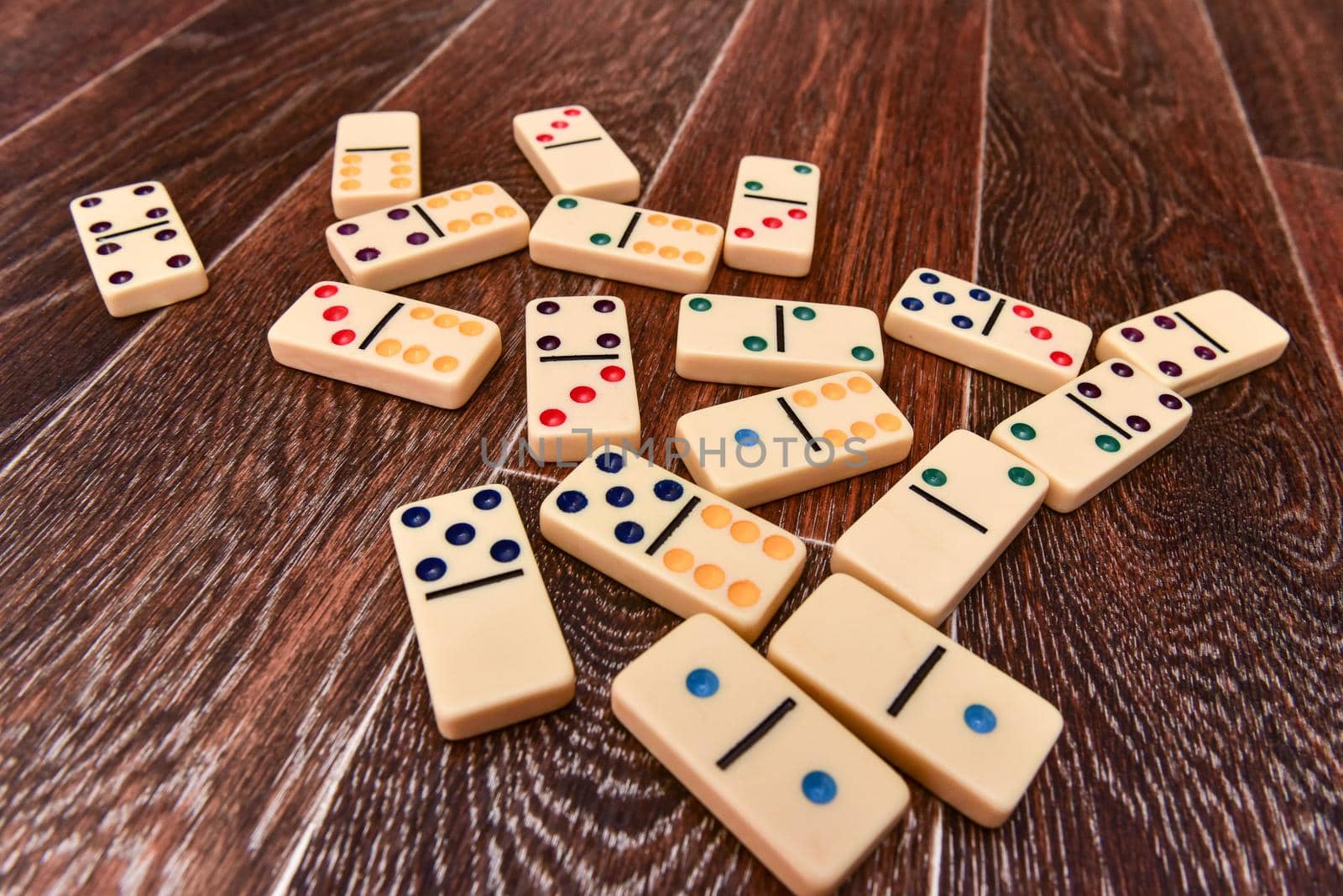 domino blocks lying on an old wooden surface. flat lay. top view.