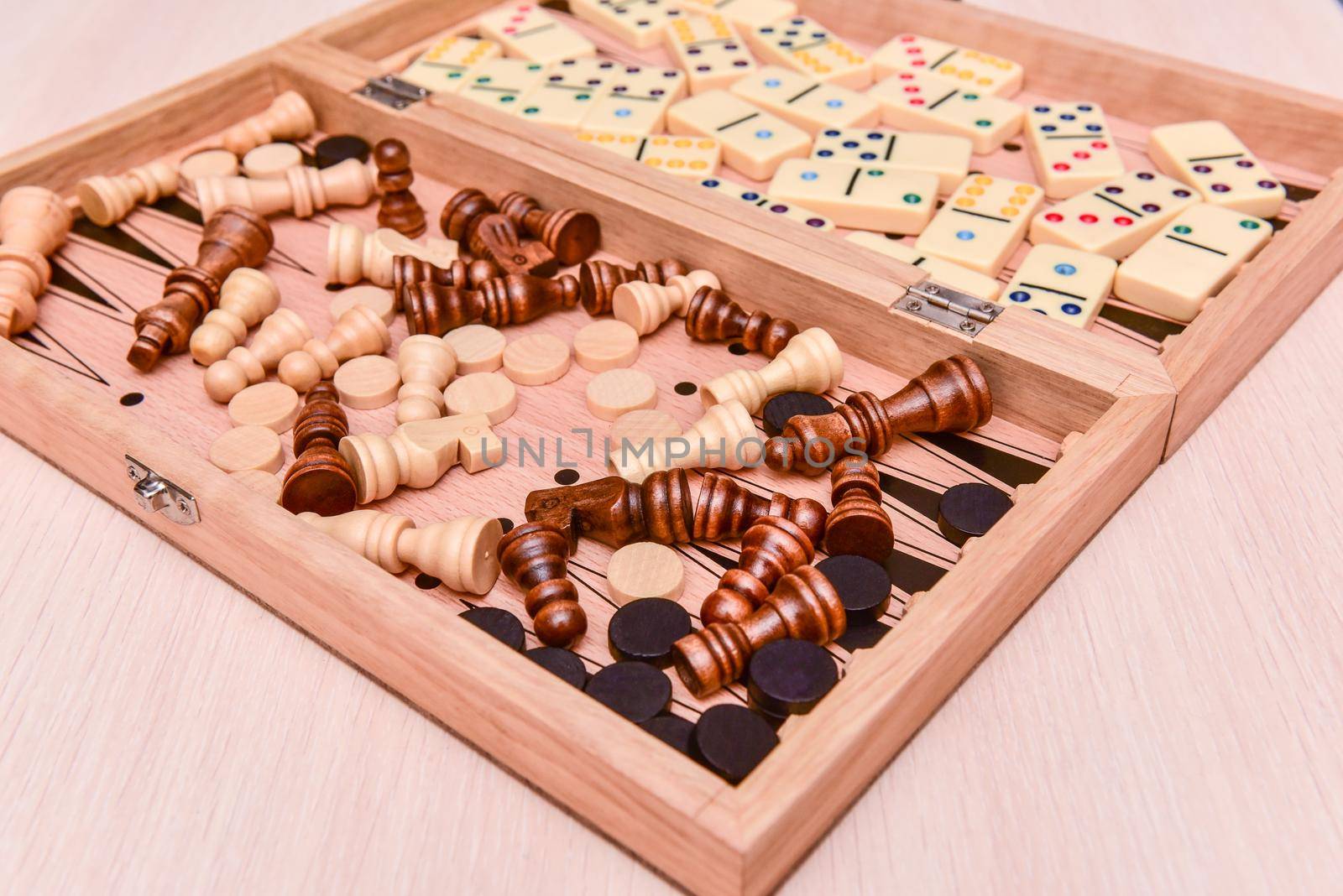 checkers, chess, dominoes and backgammon. set of board games