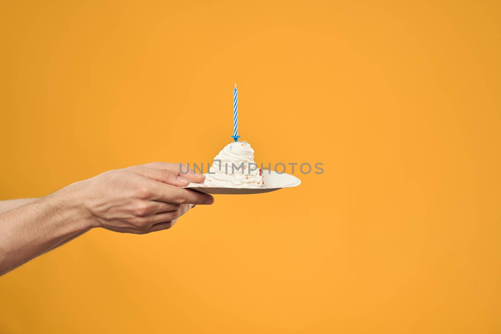 cake with candle celebration birthday decoration yellow background by SHOTPRIME