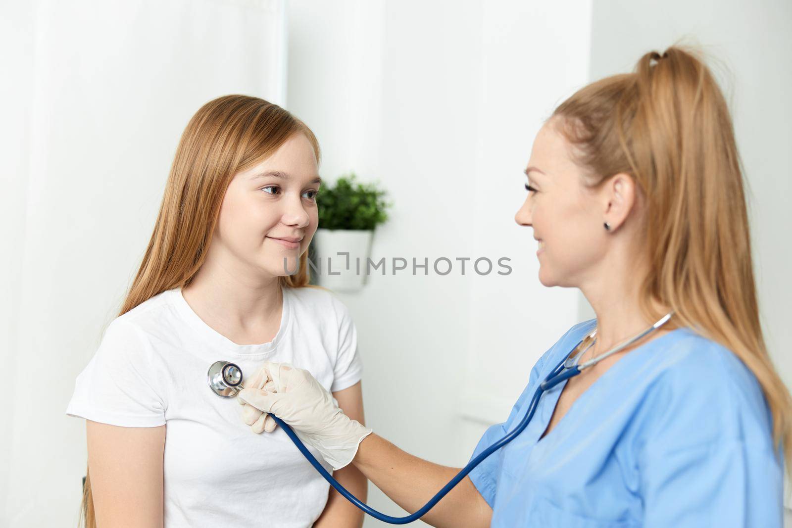 woman doctor examining a child hospital health treatment by SHOTPRIME