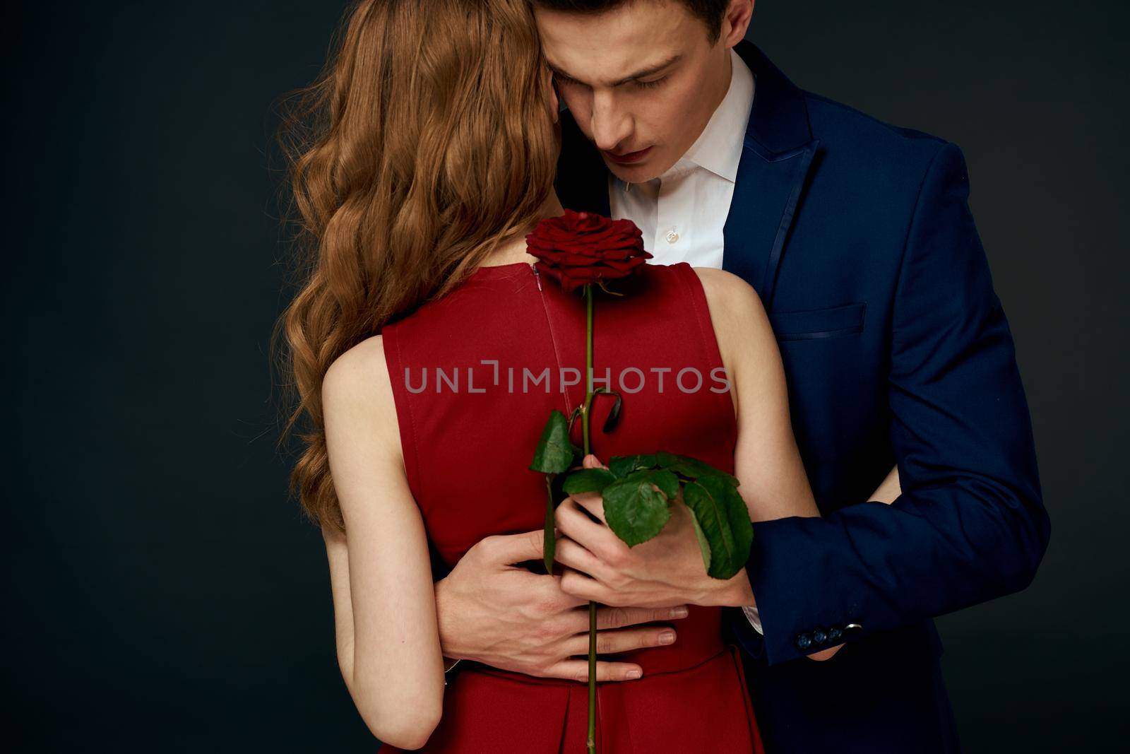 Young couple embrace romance rose tree charm luxury. High quality photo