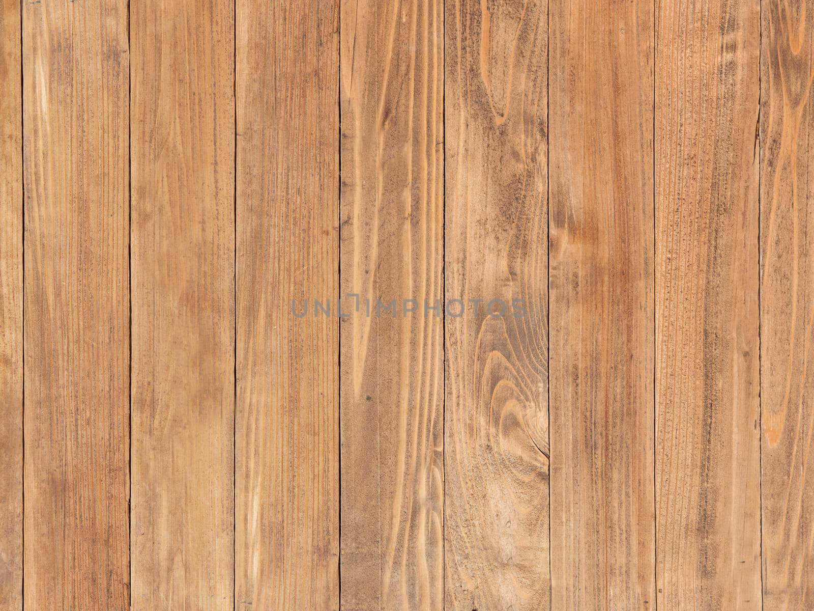 The backdrop of the vertical wooden boards brown color.Texture or background