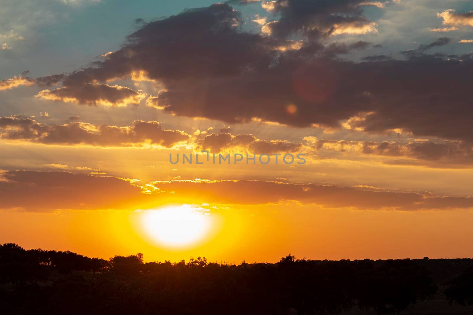 Sunset with vibrant colors in southern Andalusia in Spain by loopneo