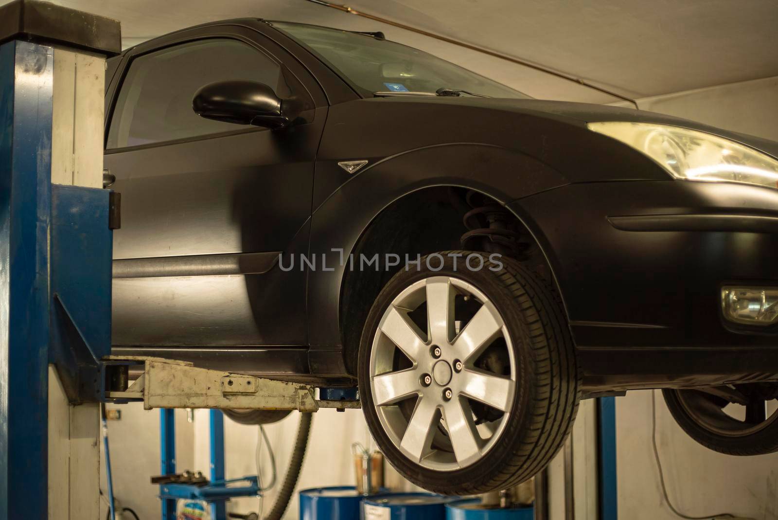 Automobile on overhead crane in the workshop for maintenance