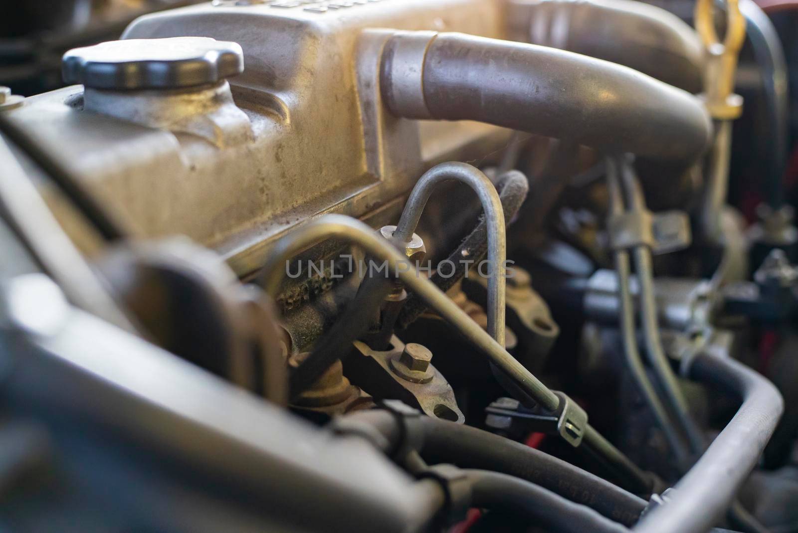 Detail of the diesel injectors in a car engine being repaired