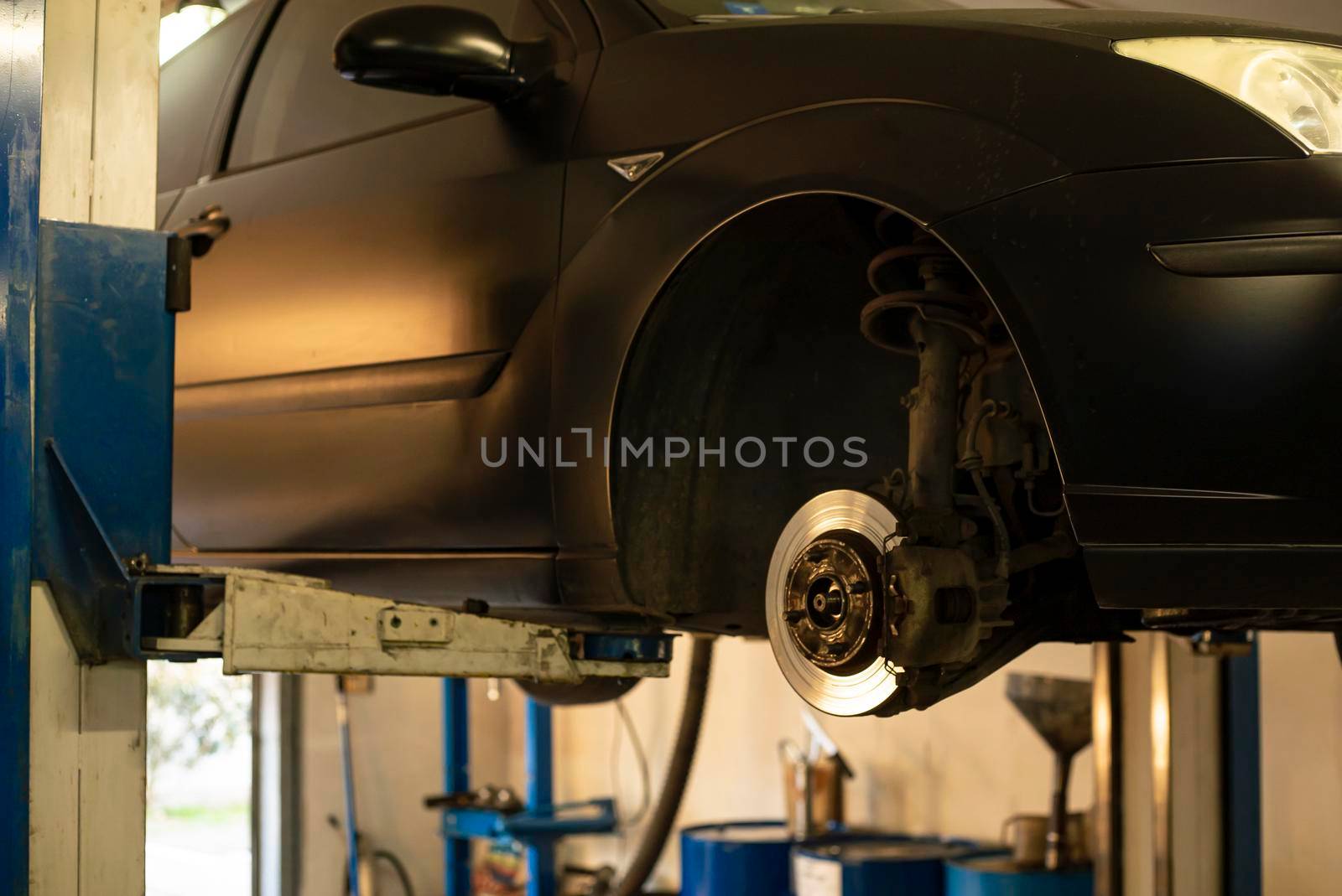 Automobile on overhead crane in the workshop for maintenance