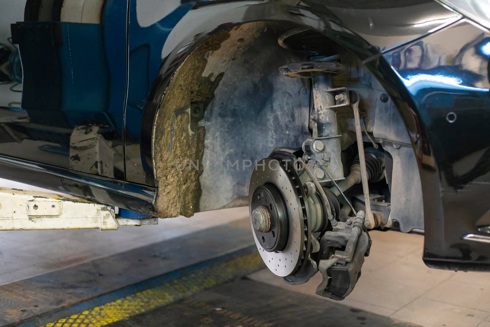 Detail of the Replacement of a car disc brake in the mechanical workshop