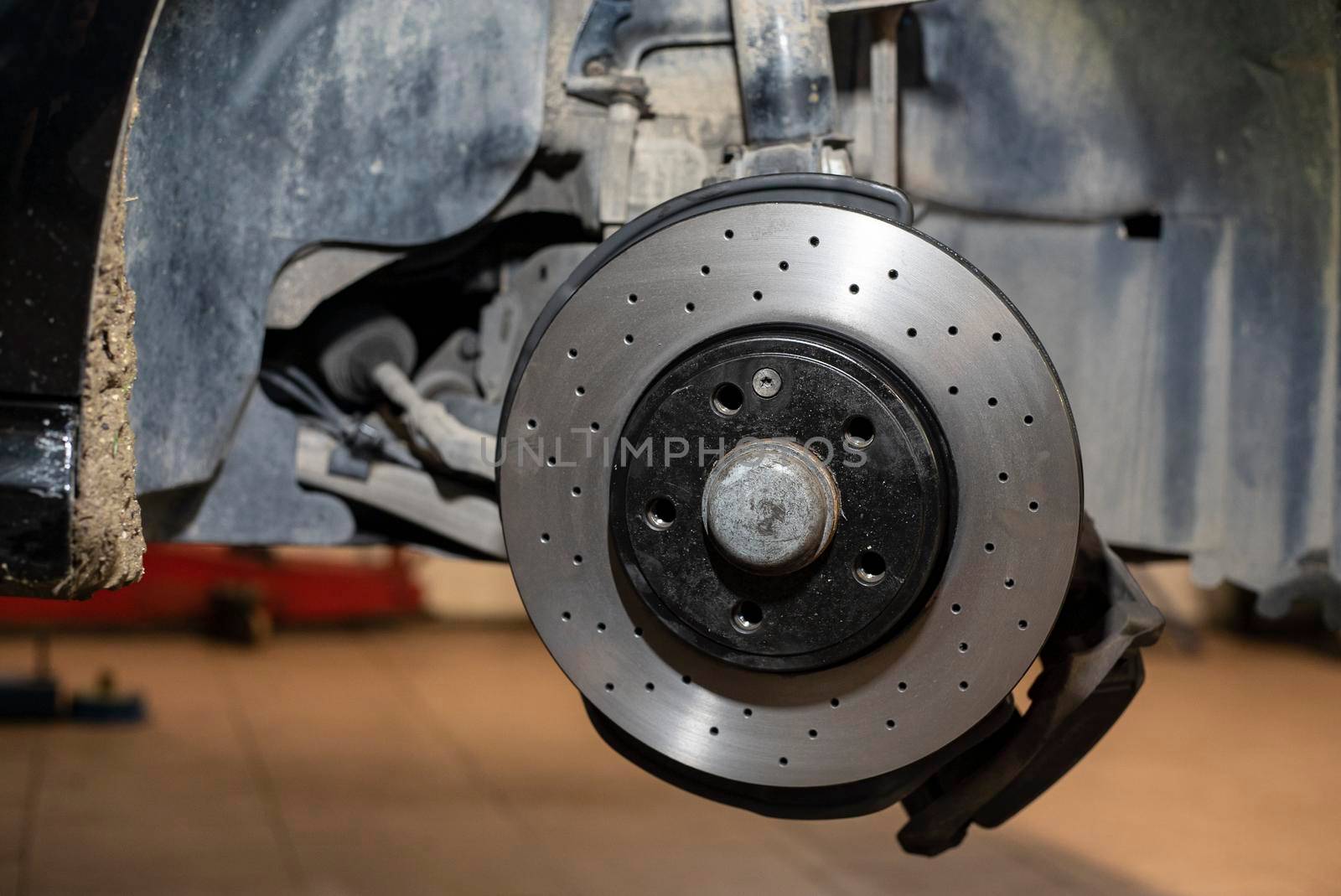 Detail of the Replacement of a car disc brake in the mechanical workshop