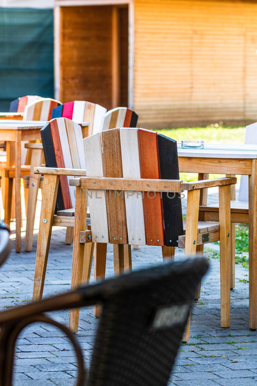 Close up of an empty table with empty chairs at a local outdoor resturant. Alba Iulia, Romania, 2021