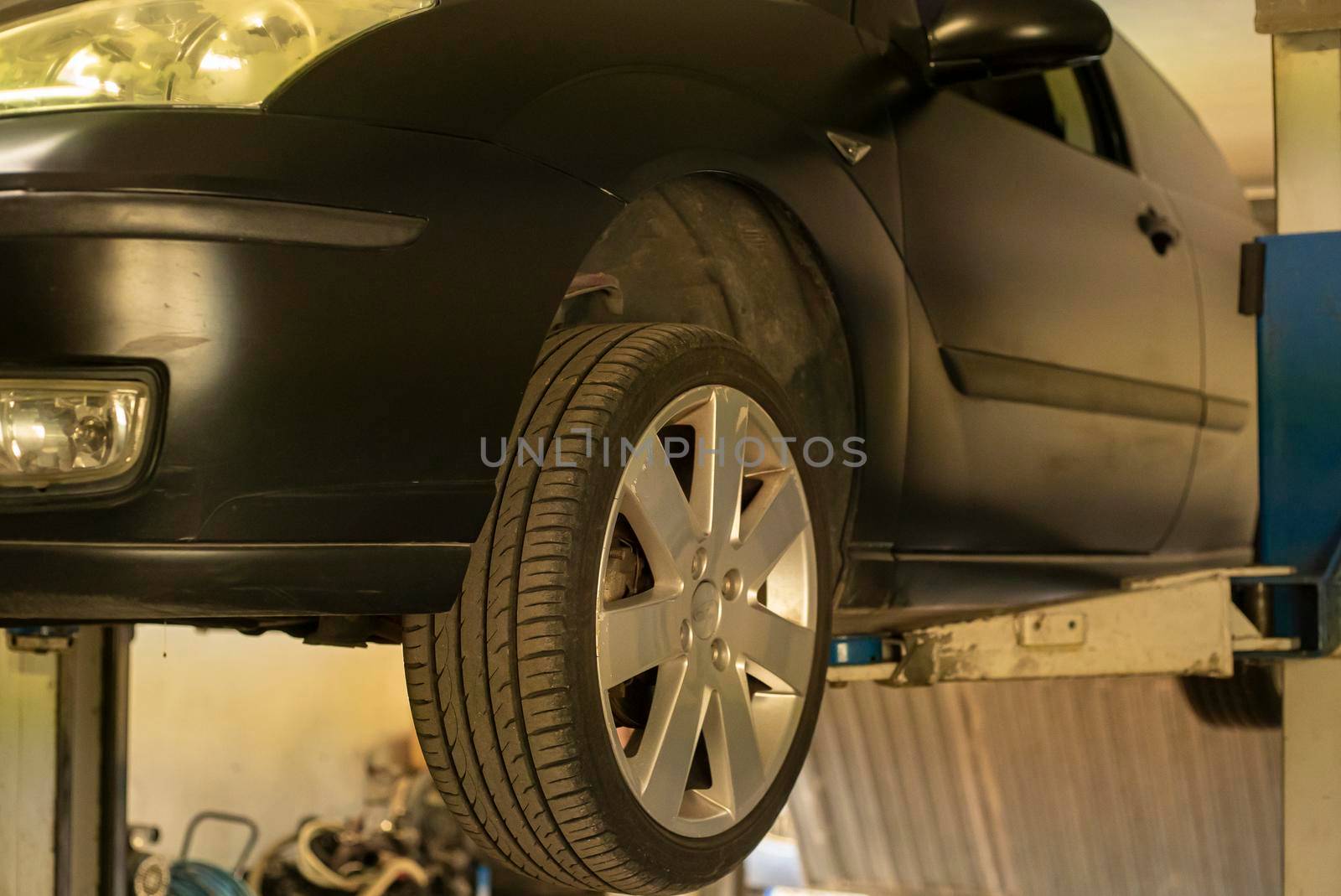 Automobile on overhead crane in the workshop for maintenance