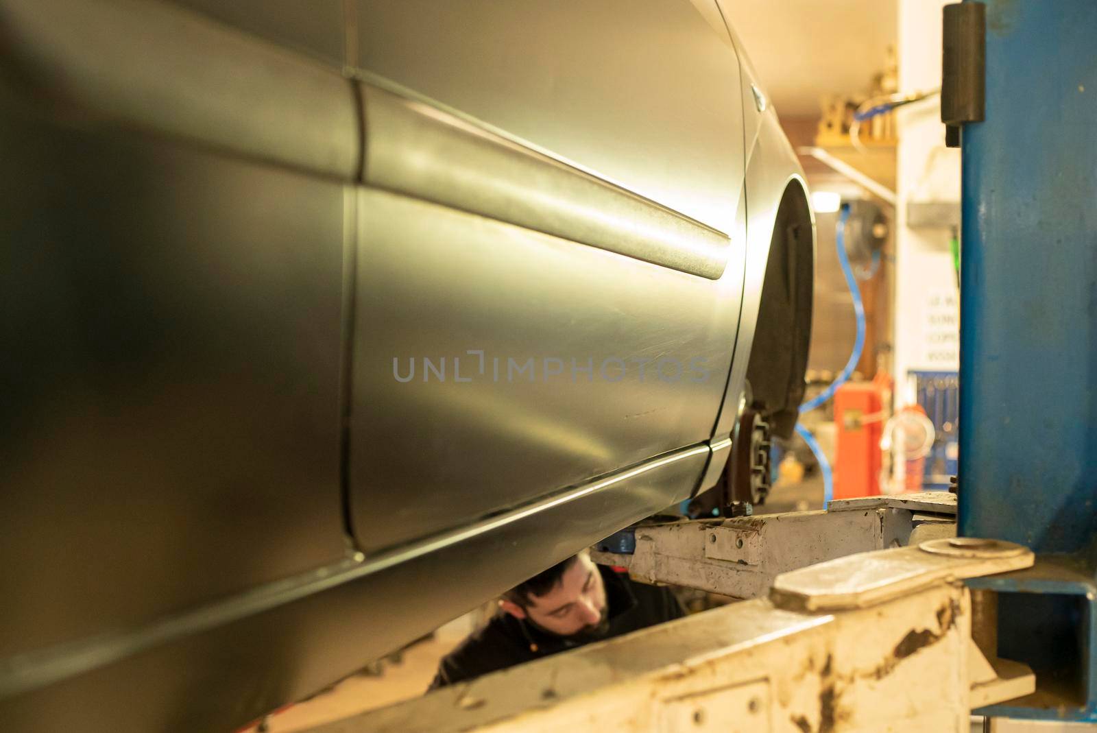 Automobile on overhead crane in the workshop for maintenance