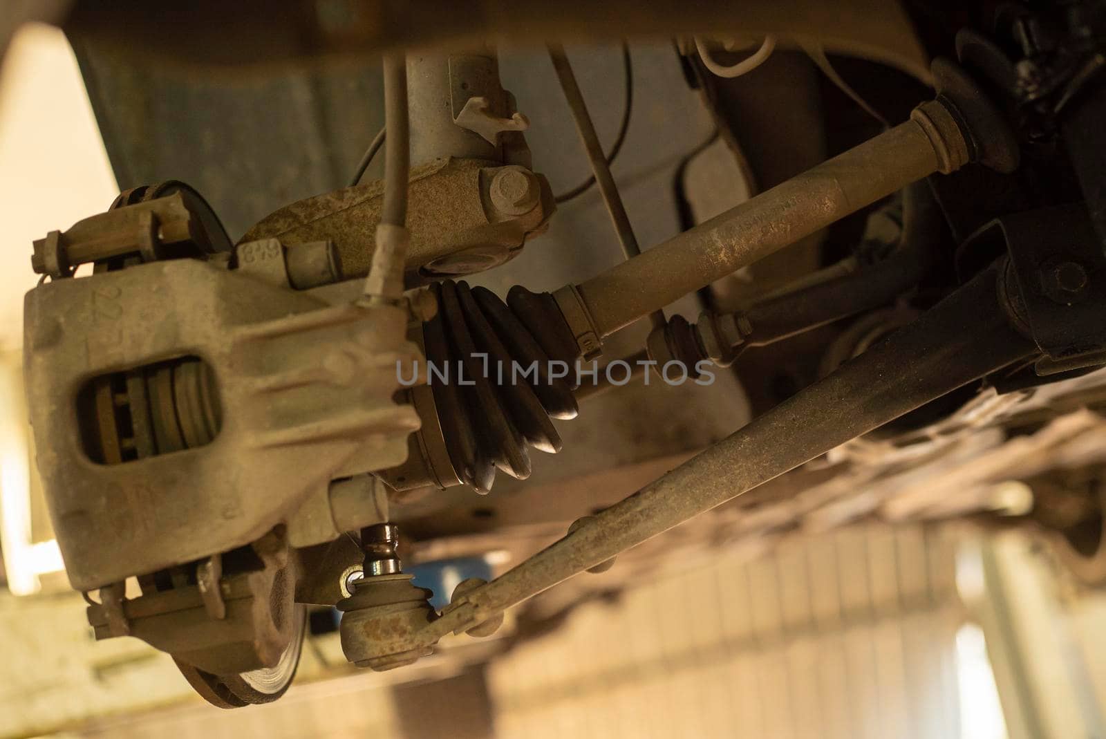 Detail of a drive shaft of the car while it is being repaired