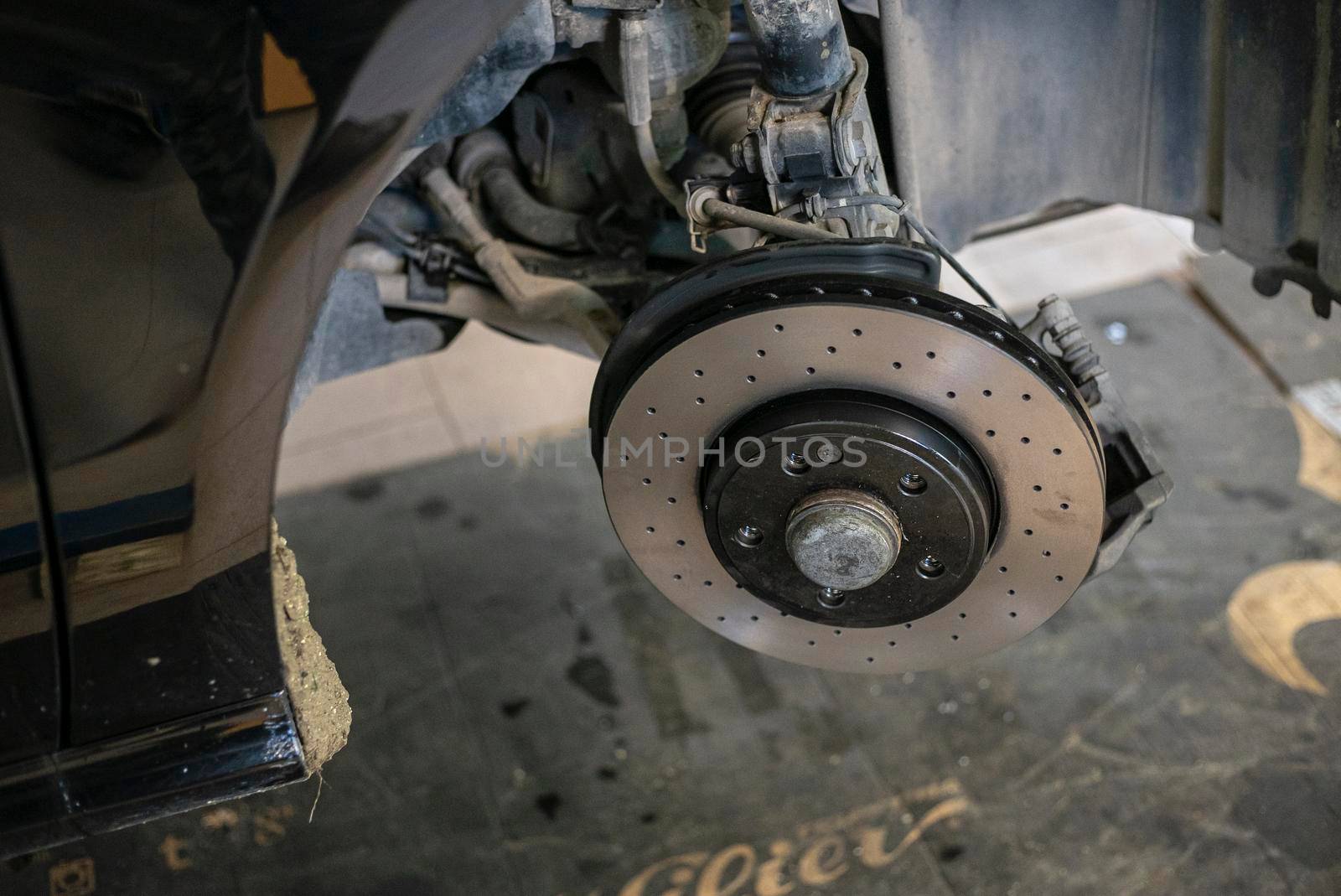 Detail of the Replacement of a car disc brake in the mechanical workshop