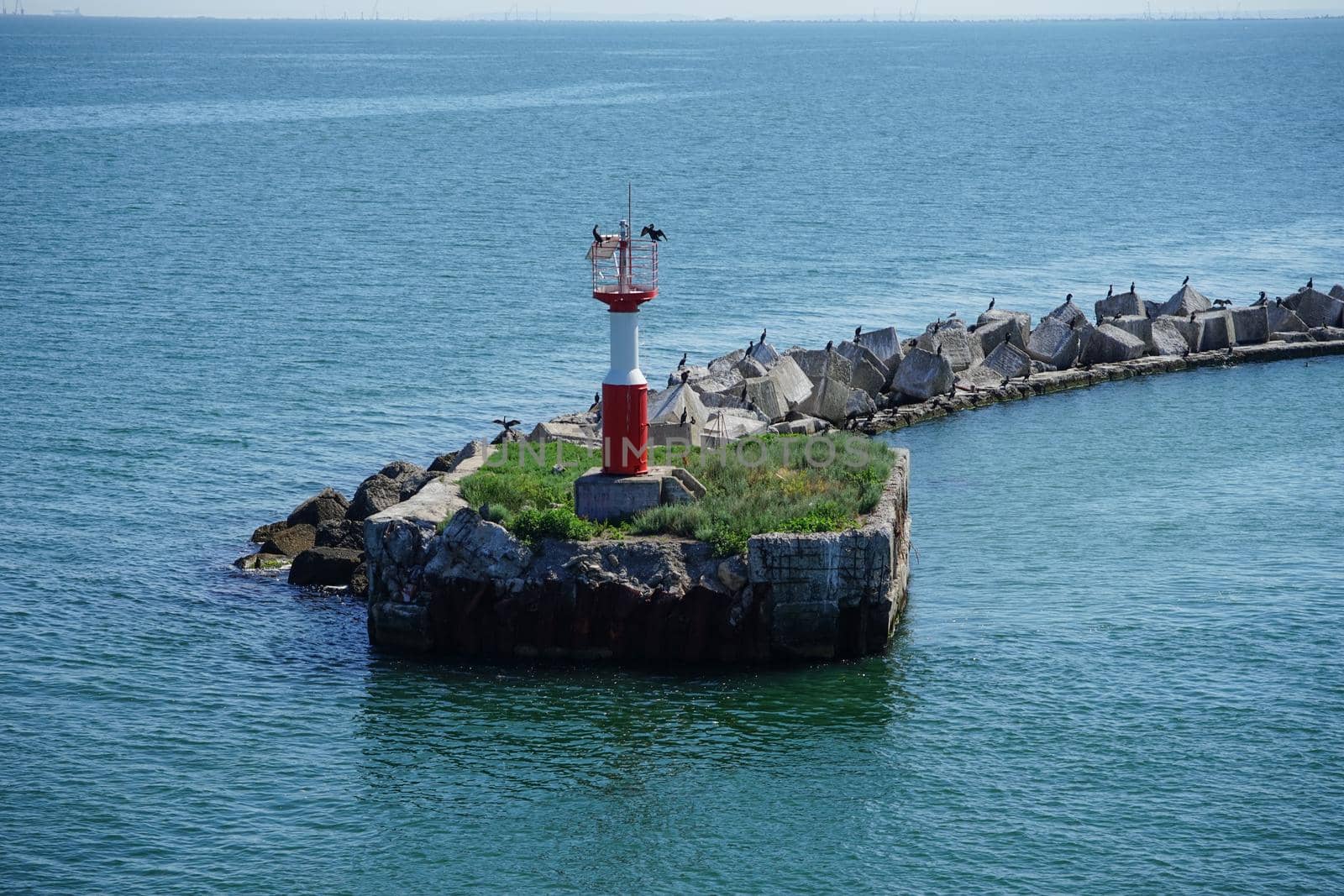 Kerch, Crimea. Marine landscape with views of the lighthouse and the cormorant.