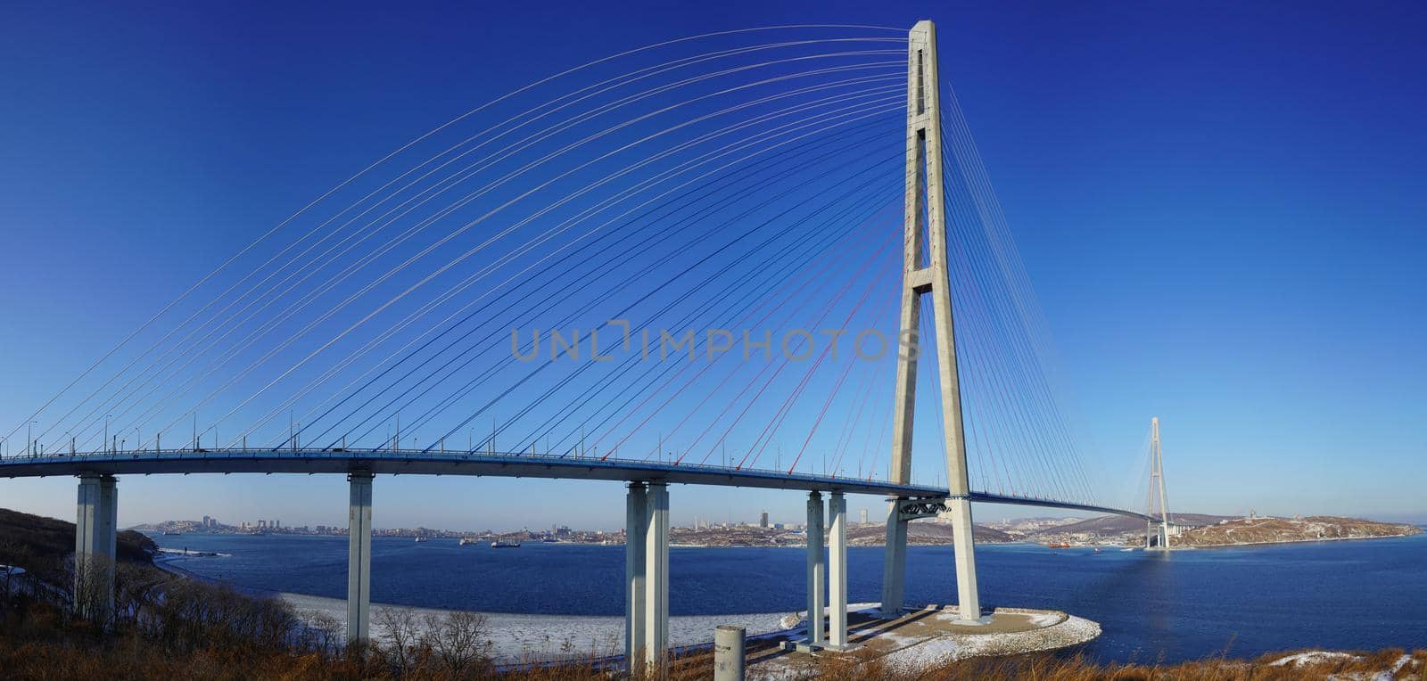 Panorama of the sea landscape with a view of the Russian bridge and Voroshilov battery. Vladivostok, Russia.