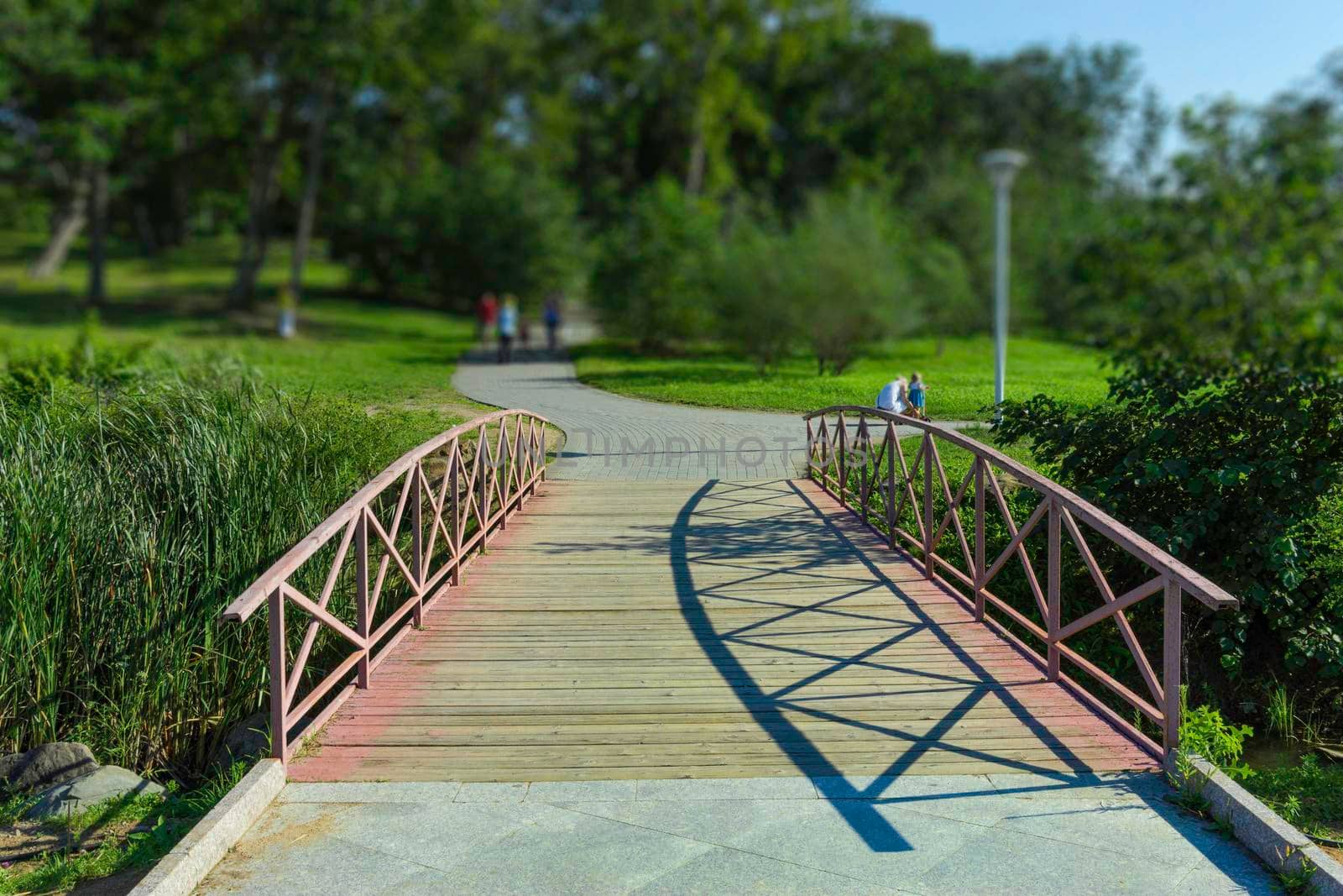 Elegant wooden bridge on a public Park background on a Sunny day. Vladivostok, Russia