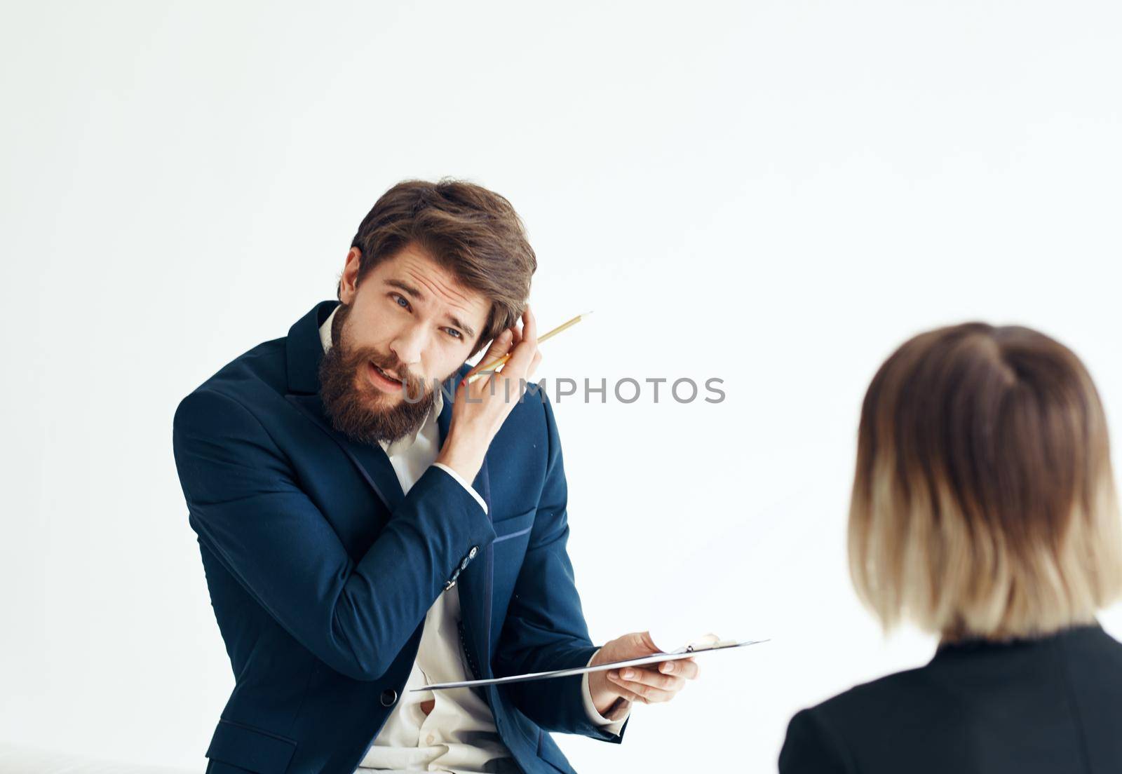 A man with documents in a suit and a woman for a job interview. High quality photo