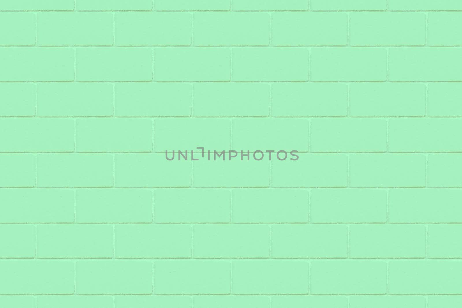 An emerald-colored wall with a detailed close-up texture.Texture or background