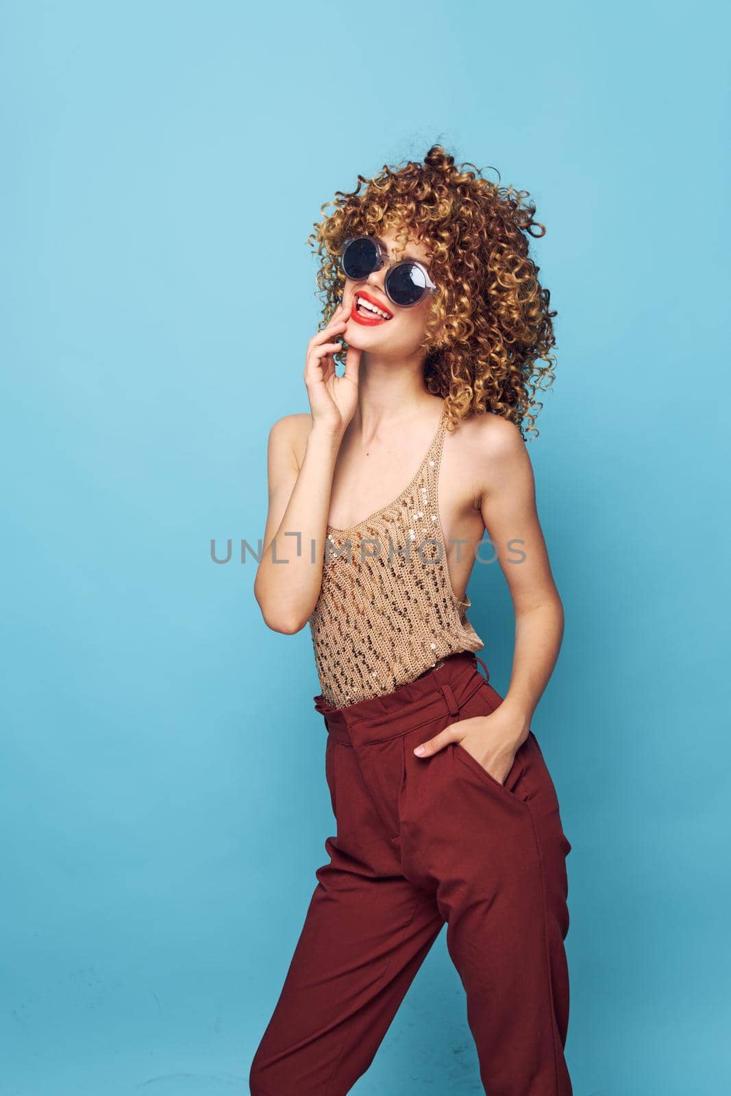Beautiful woman Lifestyle Studio curly hair smile red lips fashion clothes by SHOTPRIME