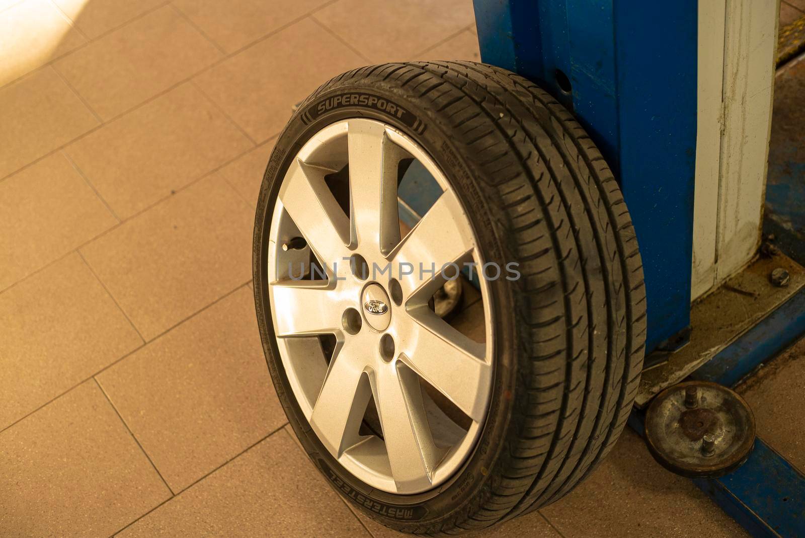 Wheel of the car in the workshop by pippocarlot