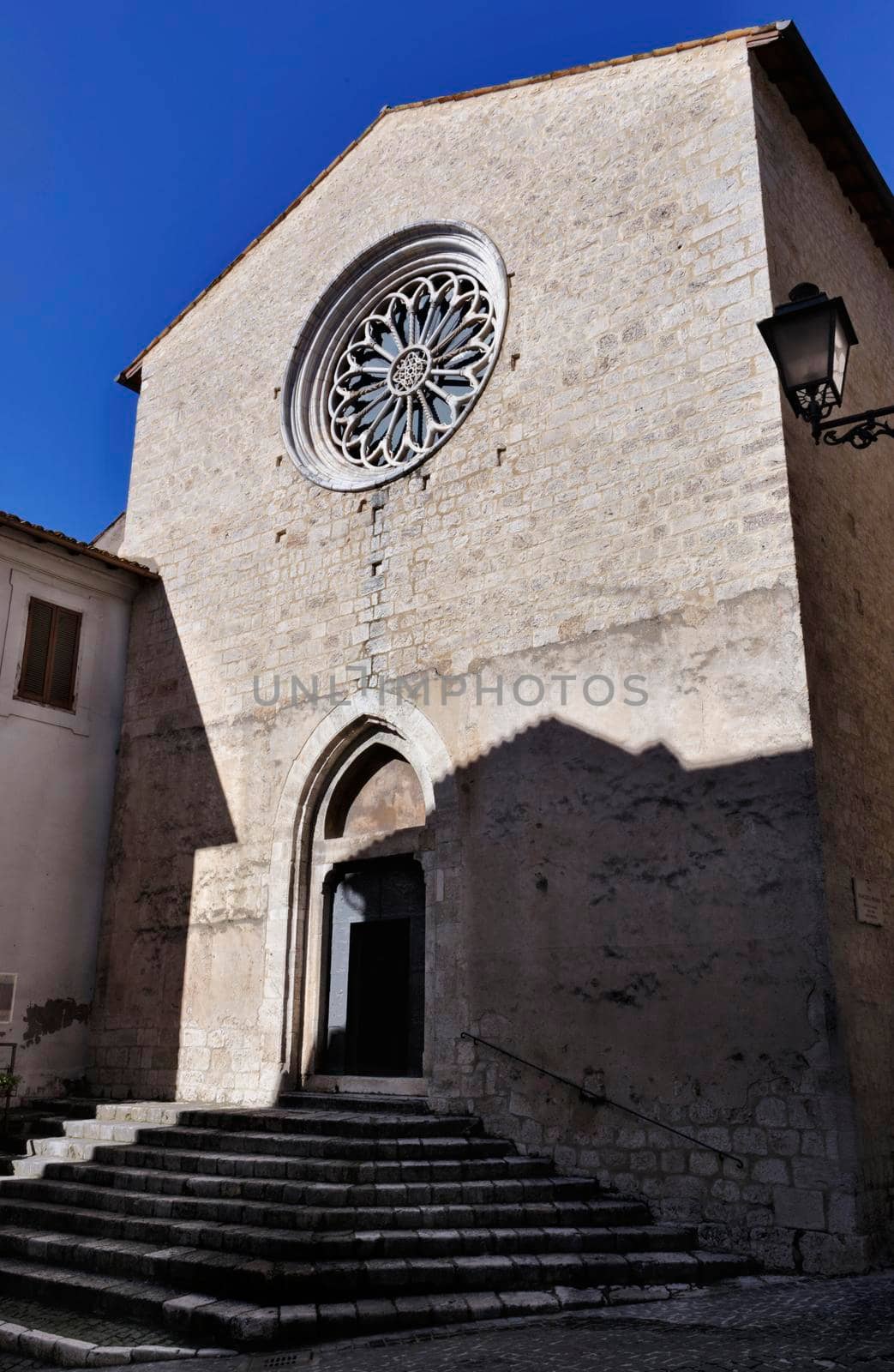 Facade of St. Francis church of Alatri , built at the end of XIII century in Gothic style , beautiful rose window with radial columns