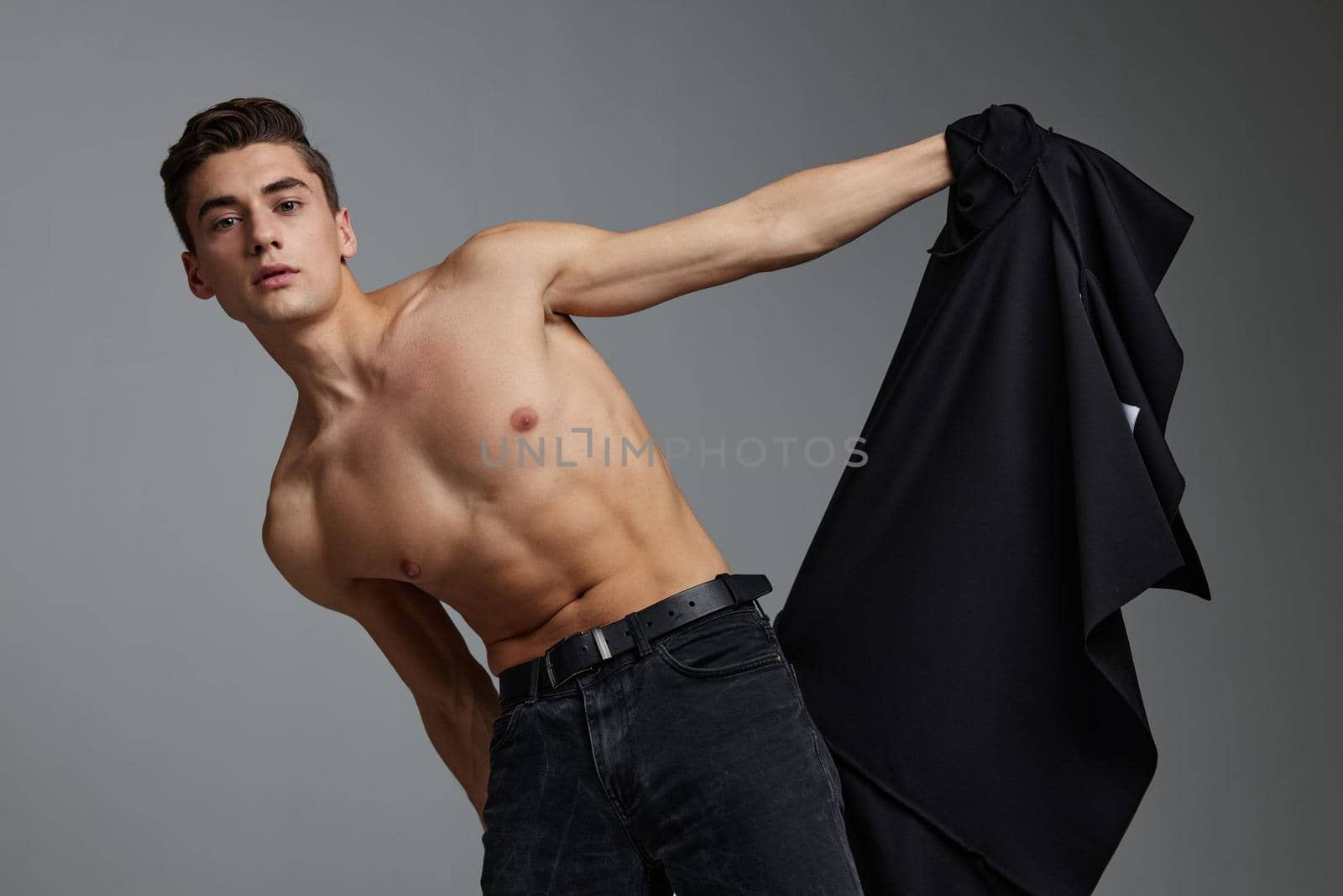 Man with muscular topless black shirt attractiveness lifestyle by SHOTPRIME