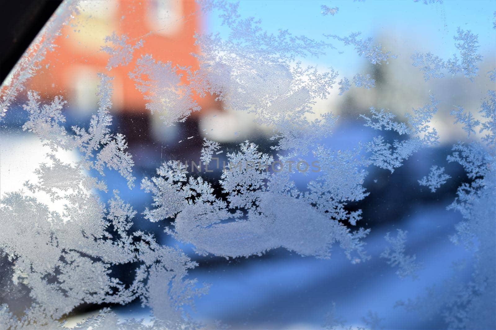 Texture as a frosty pattern on a window glass as a close-up