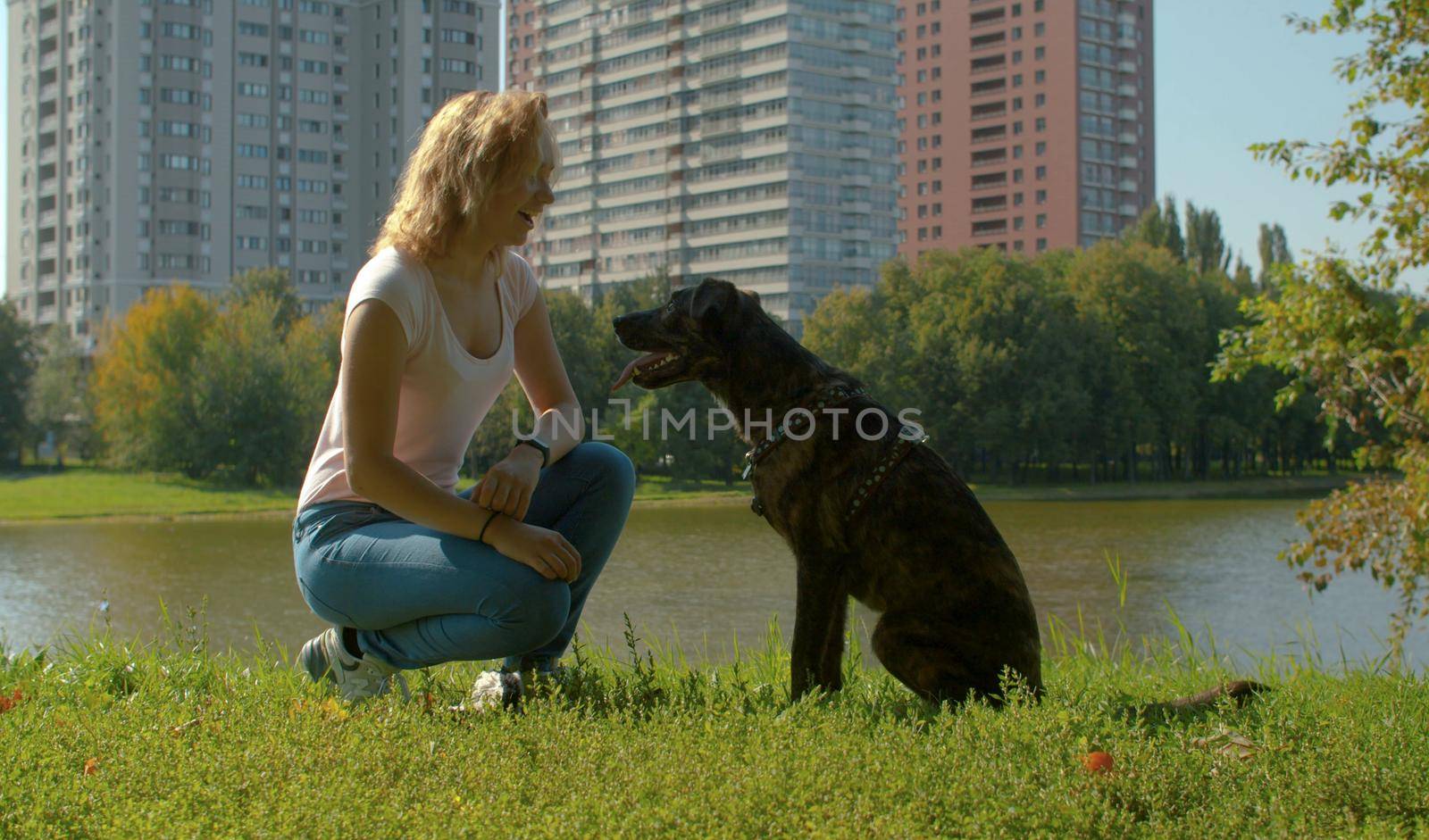 Two friends - young woman and the dog by Chudakov