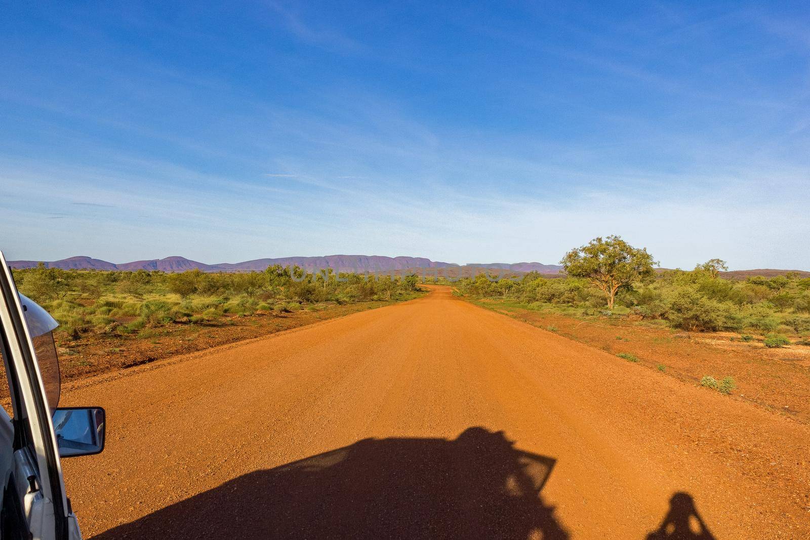 Red Australian Rural Road with Cloudy Blue Skies, Western Australia by bettercallcurry