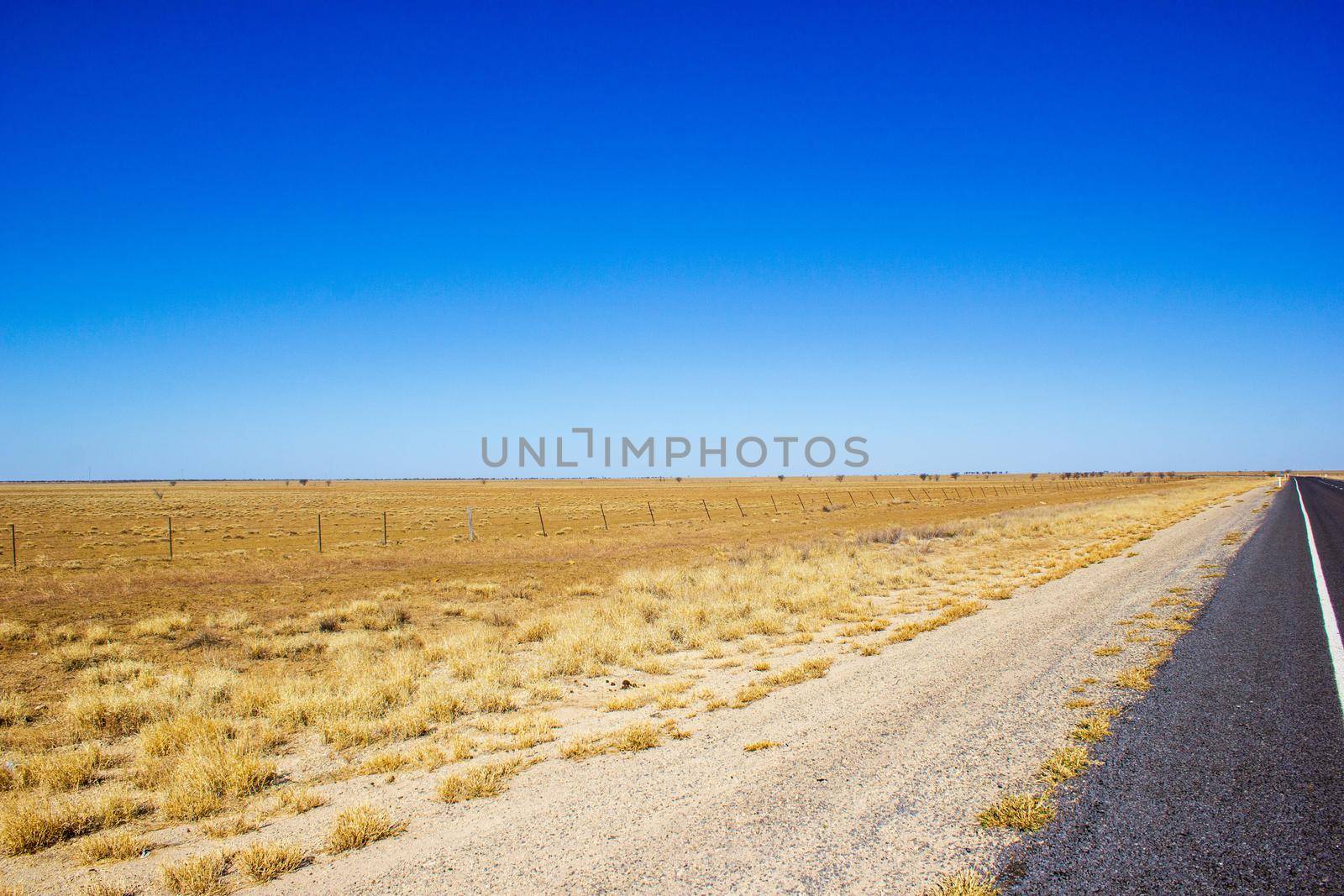 traight road in the dessert of Australia on the Flinders Hightway, Quennsland Australia by bettercallcurry