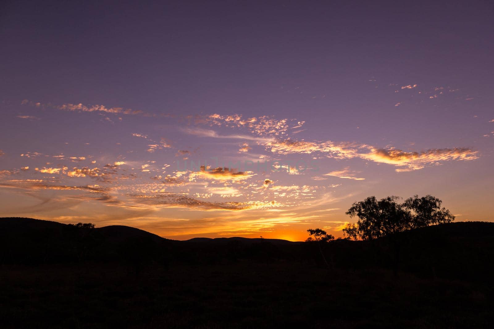 Natural Sunset Sunrise Over karijini national park. Bright Dramatic Sky And Dark Ground. Kaijiri National Park, Western Australia by bettercallcurry