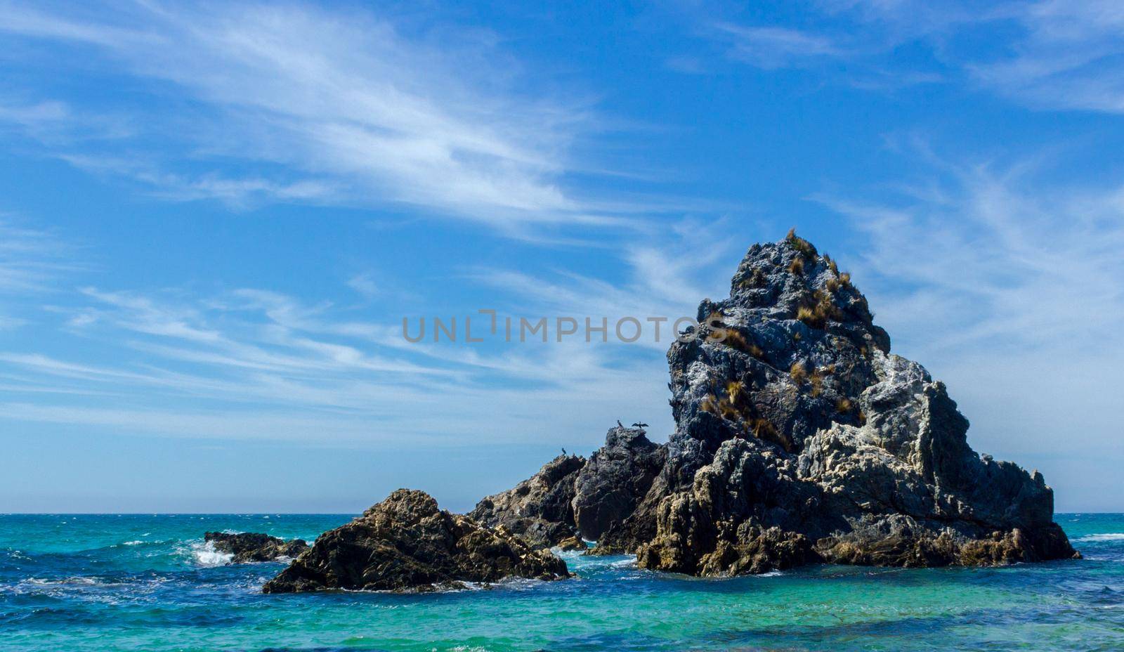 Camel rock A formation of rocks that look like a camel sitting down on the beach, situated on the far south coast Town of Bermagui in NSW Australia, famous for big game fishing and beaches.
