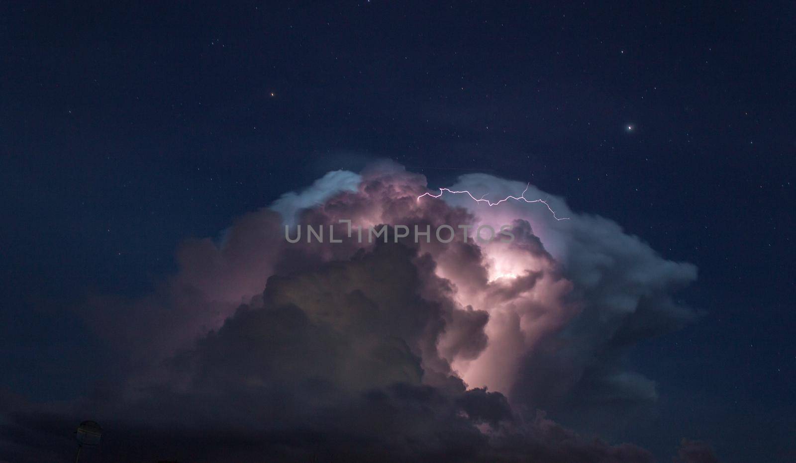 Storm cloud with some lightning in the australian outback, cloncurry, australia, northern territory.