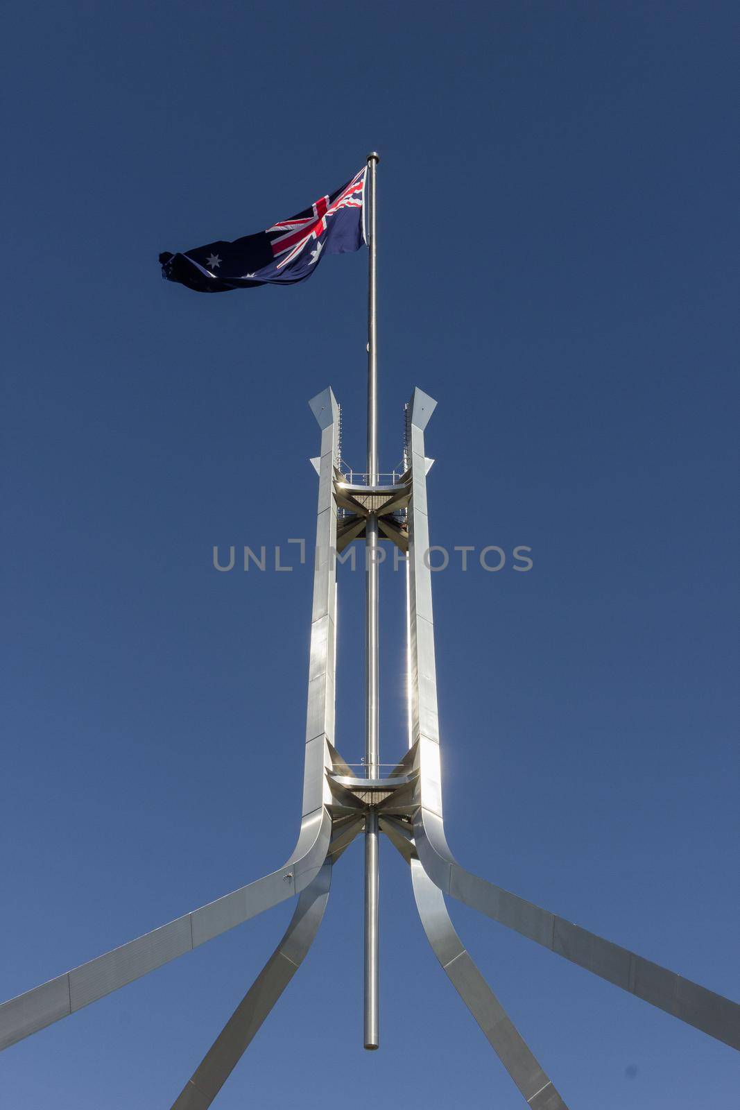 australia flag on the Parliament House in Canberra, Australia by bettercallcurry
