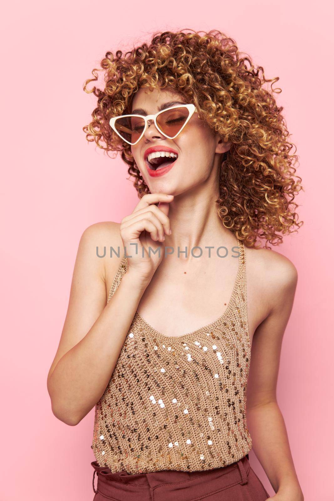 Attractive woman curly hair sunglasses studio fashionable clothes fun isolated background