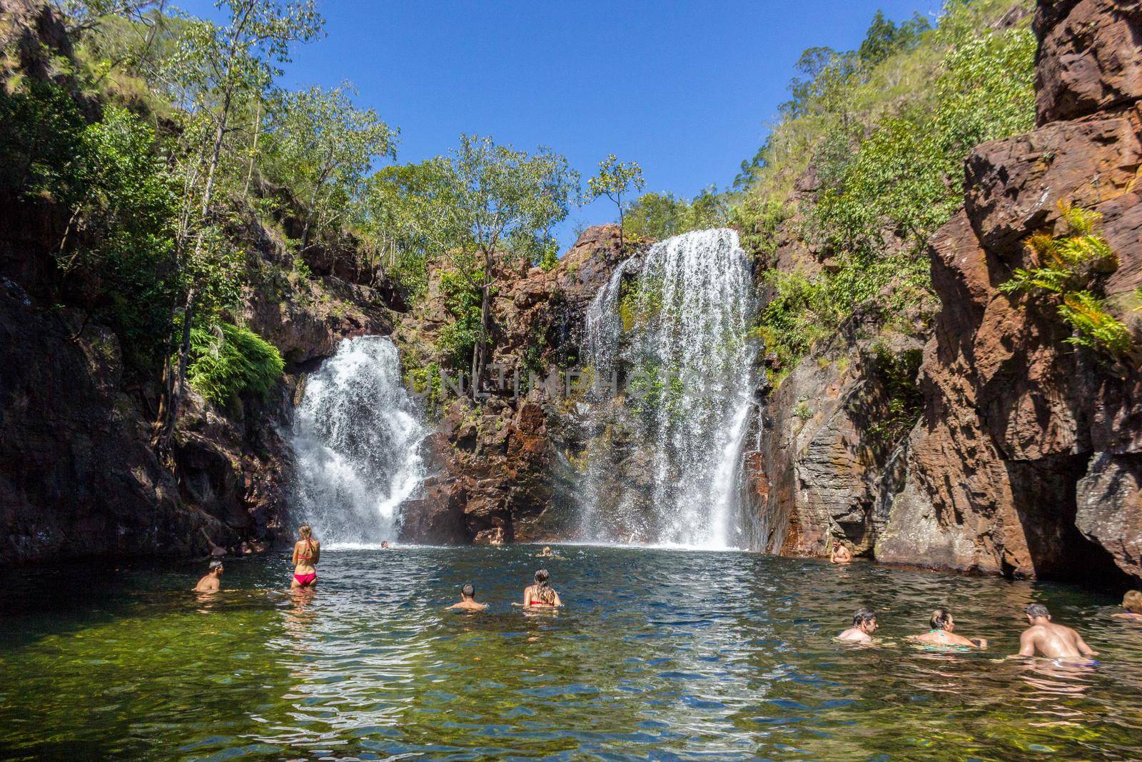 Litchfield National Park, Northern Territory, Australia - Jun 12 2013: Tourists and residents of Darwin enjoy refreshing swim at Florence Falls, very popular desitination for tourists and locals alike