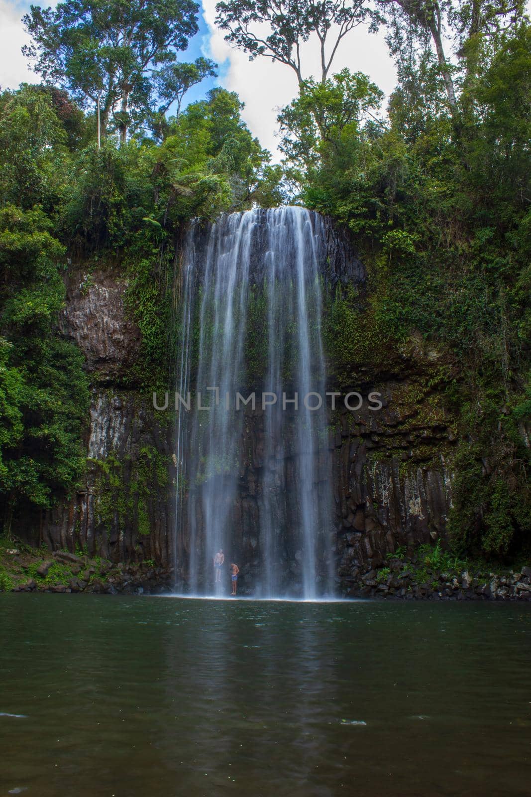 people standing under the milla milla falls and taking a shower, Queensland, Australia by bettercallcurry