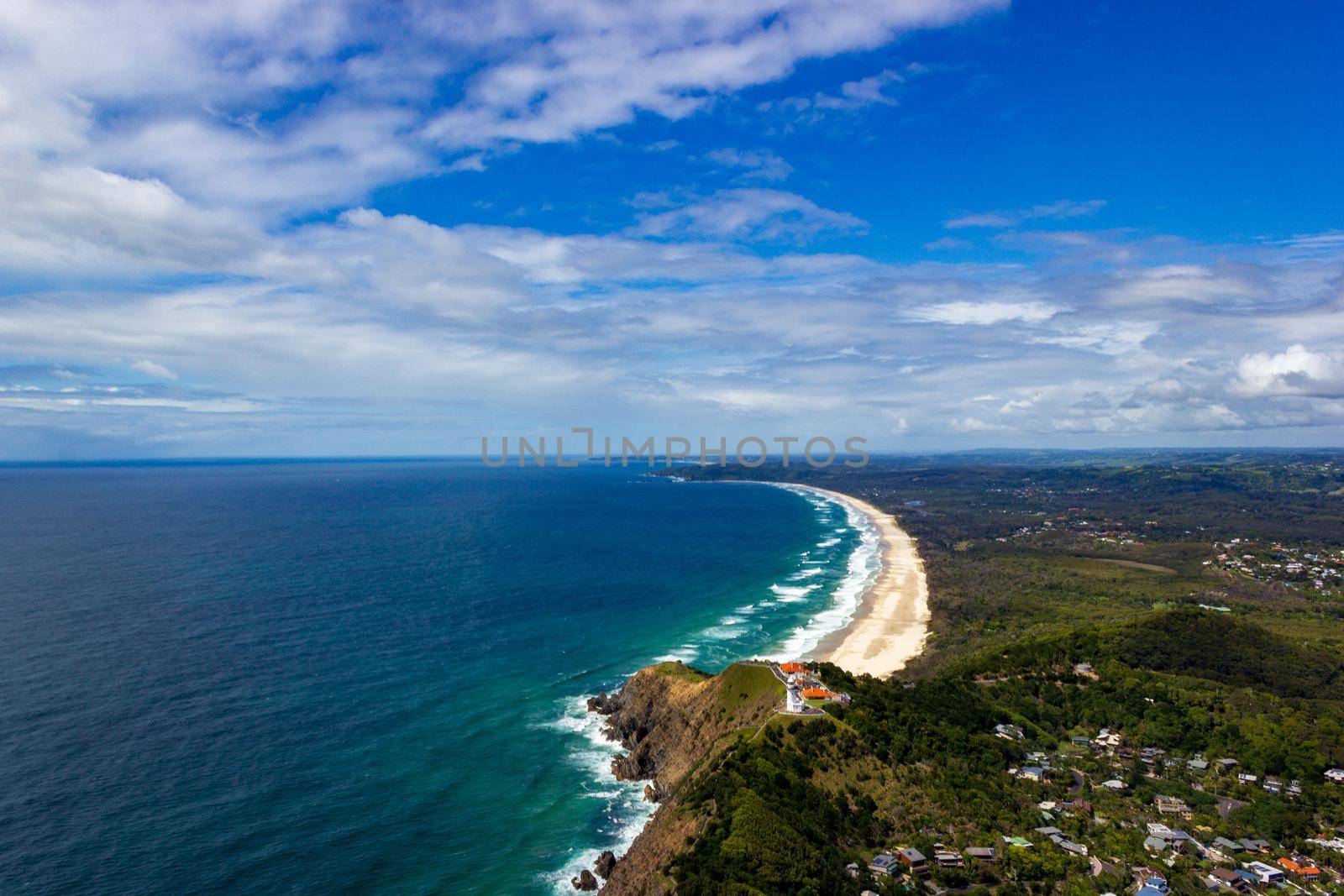 Wategoes Beach aerial view at Byron Bay with lighthouse