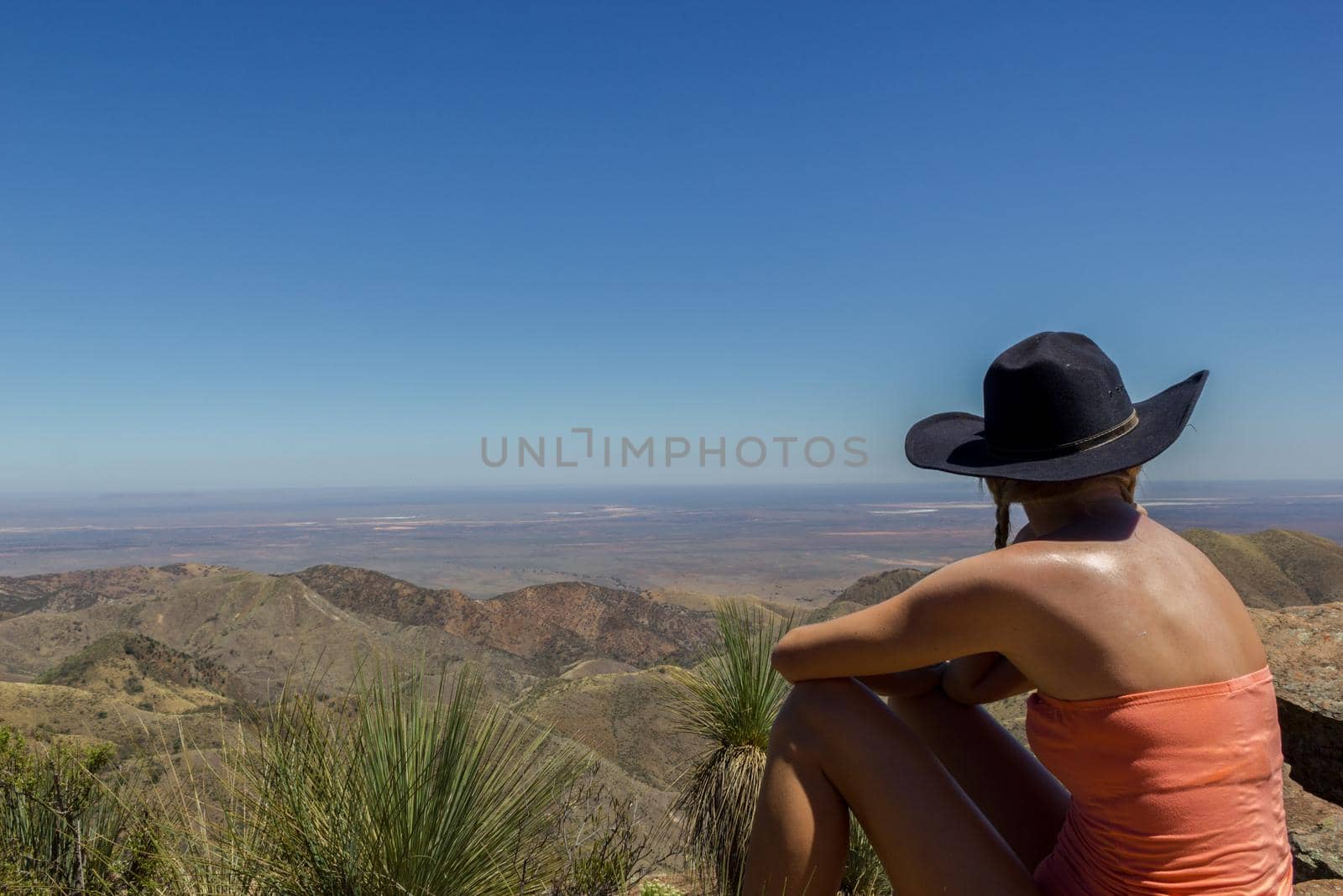 jung women with head looking down at the flinders range national park, australia