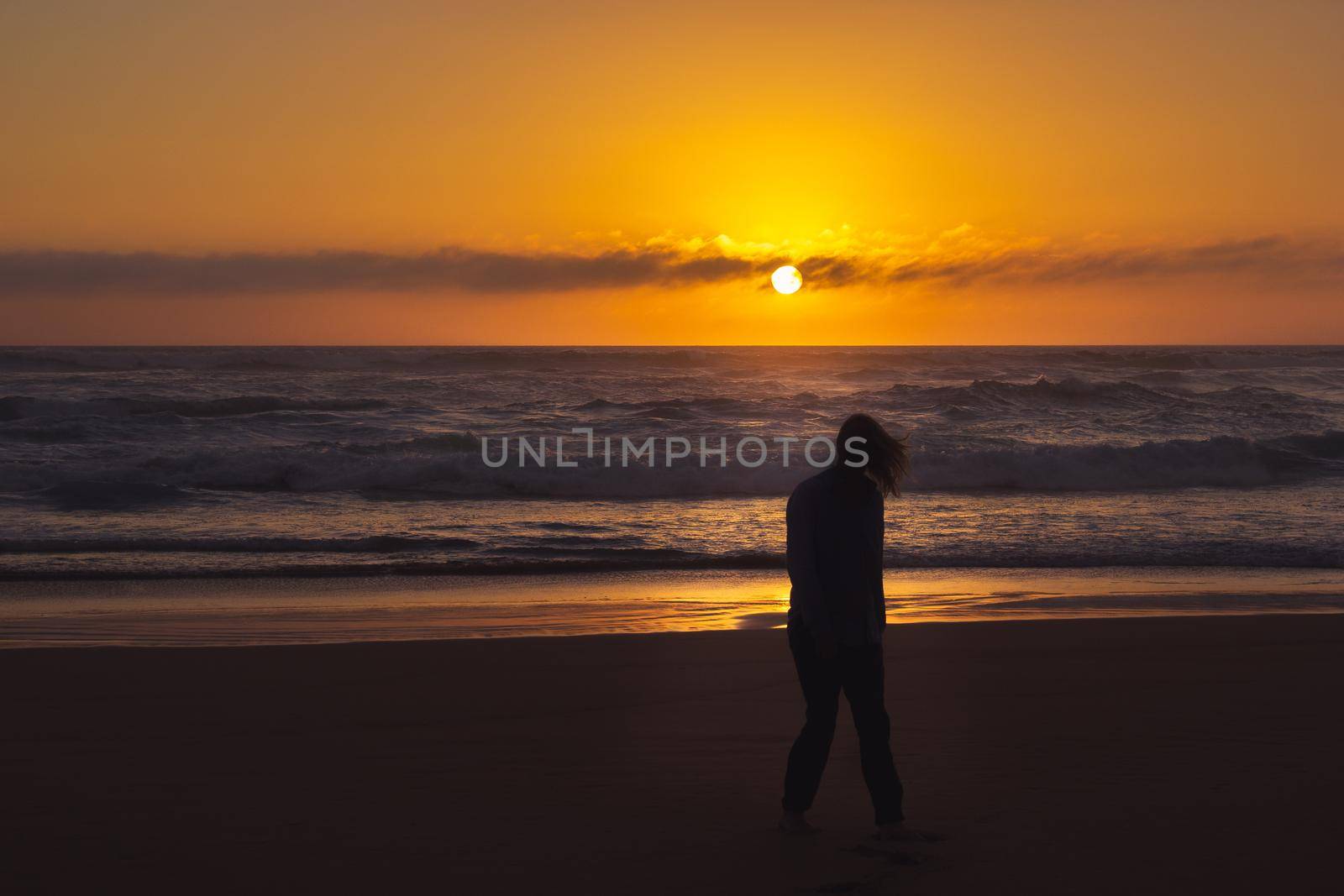 carefree woman dancing in the sunset on the beach. vacation vitality healthy living concept, Australia by bettercallcurry
