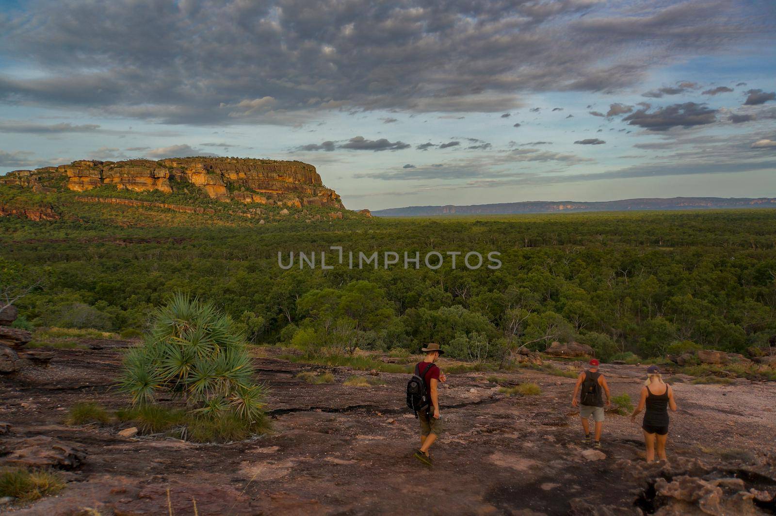 tourists walking down from the Nadab Lookout in ubirr, kakadu national park - australia, northern territory by bettercallcurry