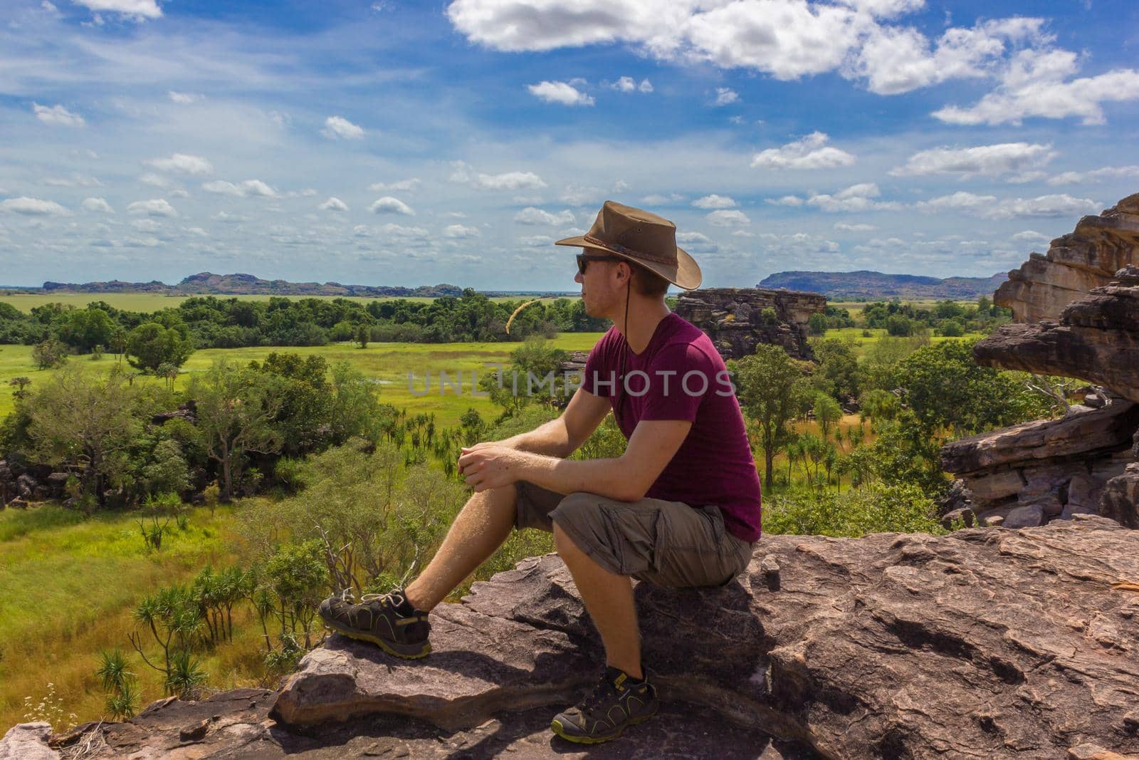 young man enyoing view from the Nadab Lookout in ubirr, kakadu national park